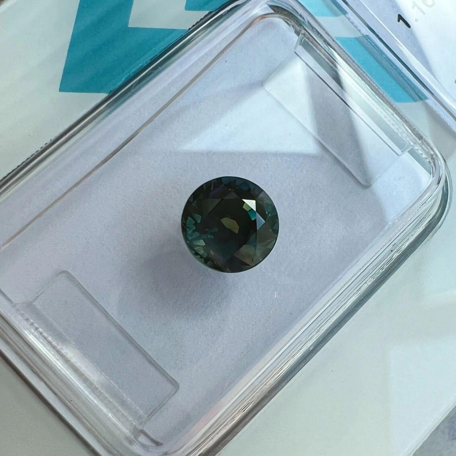 Round Cut 1.16ct Deep Orange Greenish Blue Sapphire Round Diamond Cut IGI Certified Gem For Sale