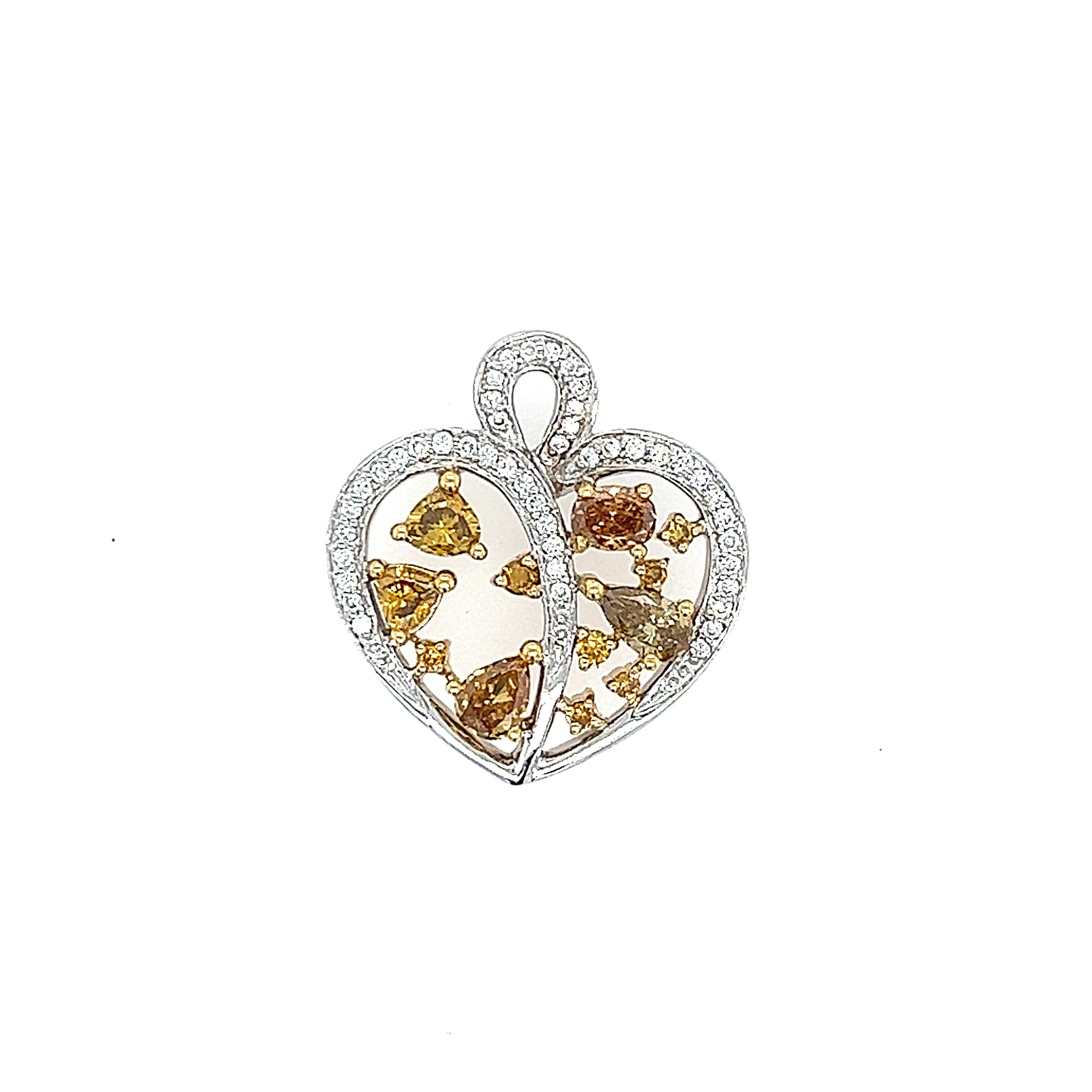 Multi natural yellowish brown heart shape pendant.
12 multi shape diamonds, 0.99ct carats. Approximately Fancy Intense Yellowish Brown color and SI clarity. 45 round diamonds, 0.17 carats. Approximately G/H color and SI clarity. 18k white and yellow