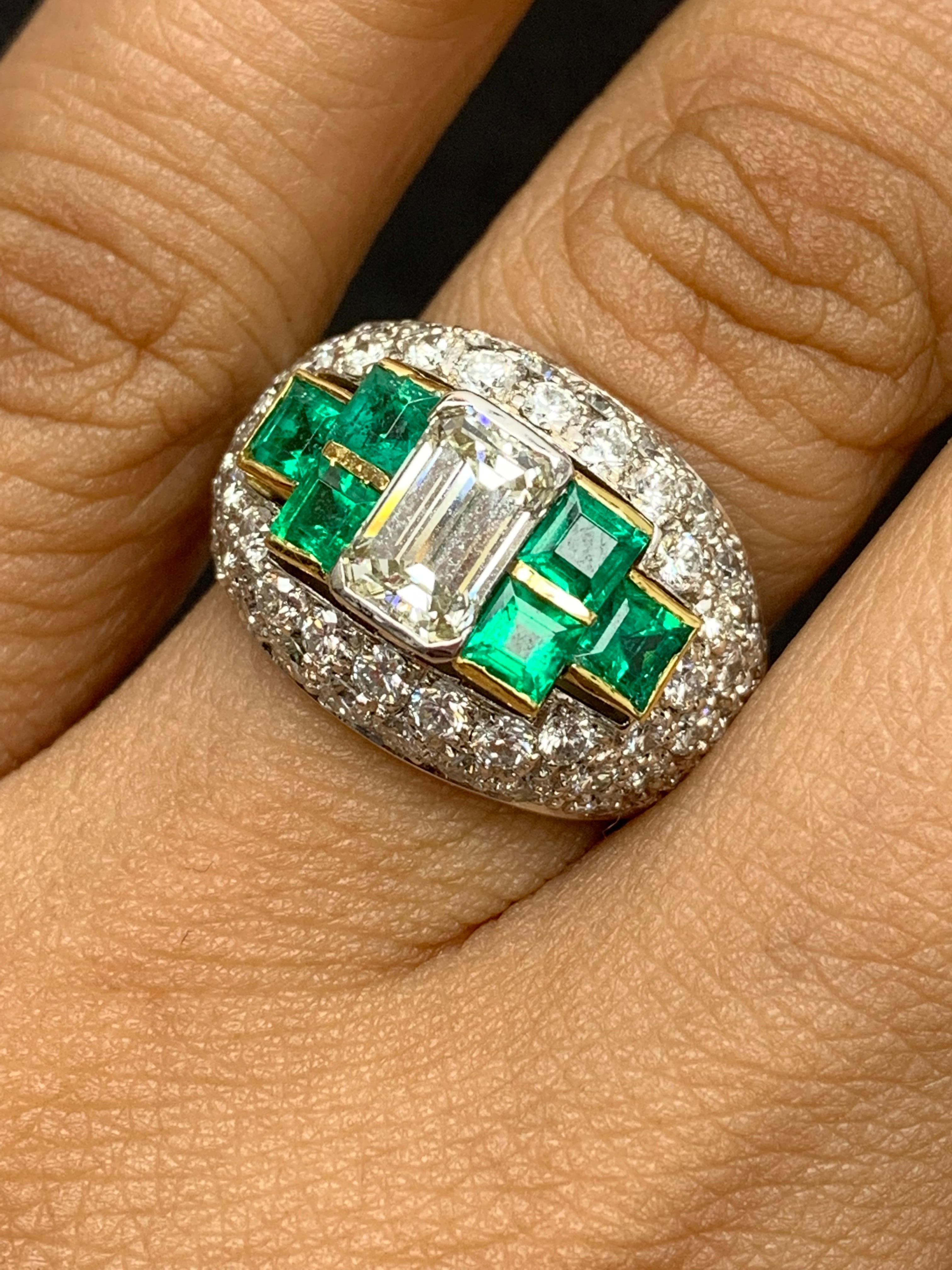 Exquisite Fancy Wide Dome Cocktail Ring adorned by Brilliant princess cut emeralds along with Round Cut Diamonds expertly placed throughout the Dome shape band.  Emerald cut Center Diamond weighs 1.17 carats. 68 diamonds weigh 2.01 carats and 1.12