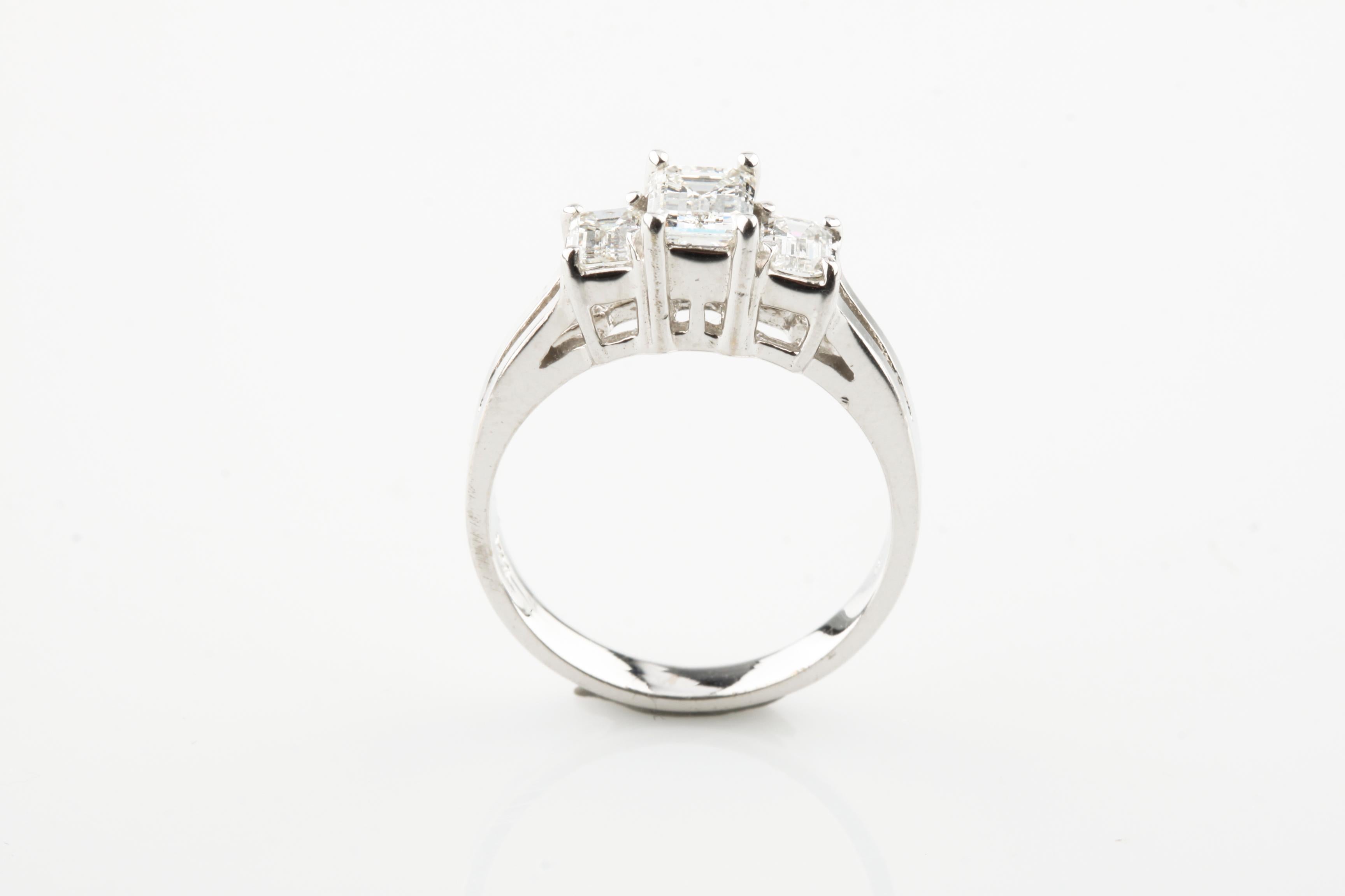 Women's 1.17 Carat Emerald Cut Diamond 18 Karat White Gold Three-Stone Engagement Ring For Sale