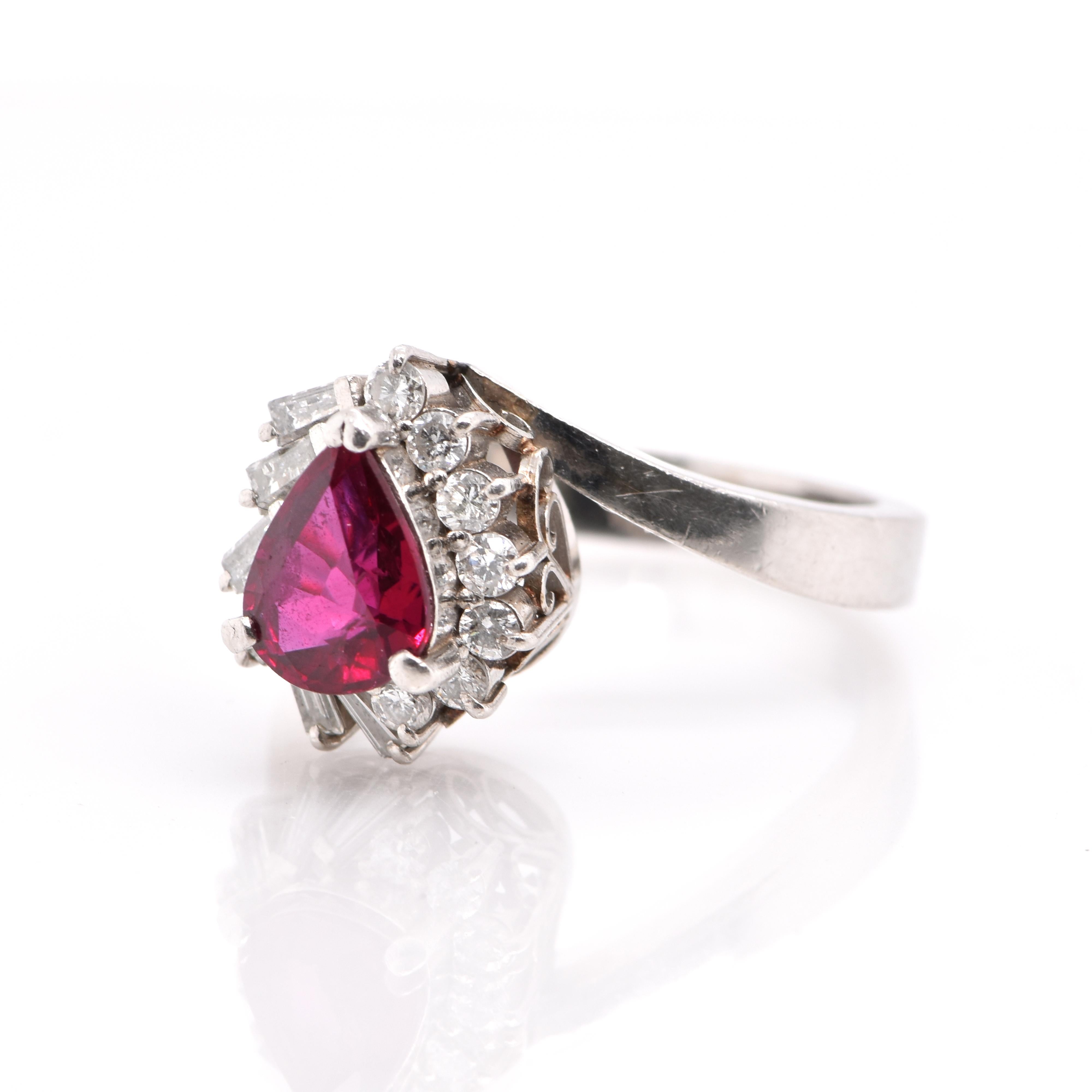 A beautiful Antique Ring featuring a 1.17 Carat Natural Ruby and 0.39 Carats of Diamond Accents set in Platinum. Rubies are referred to as 