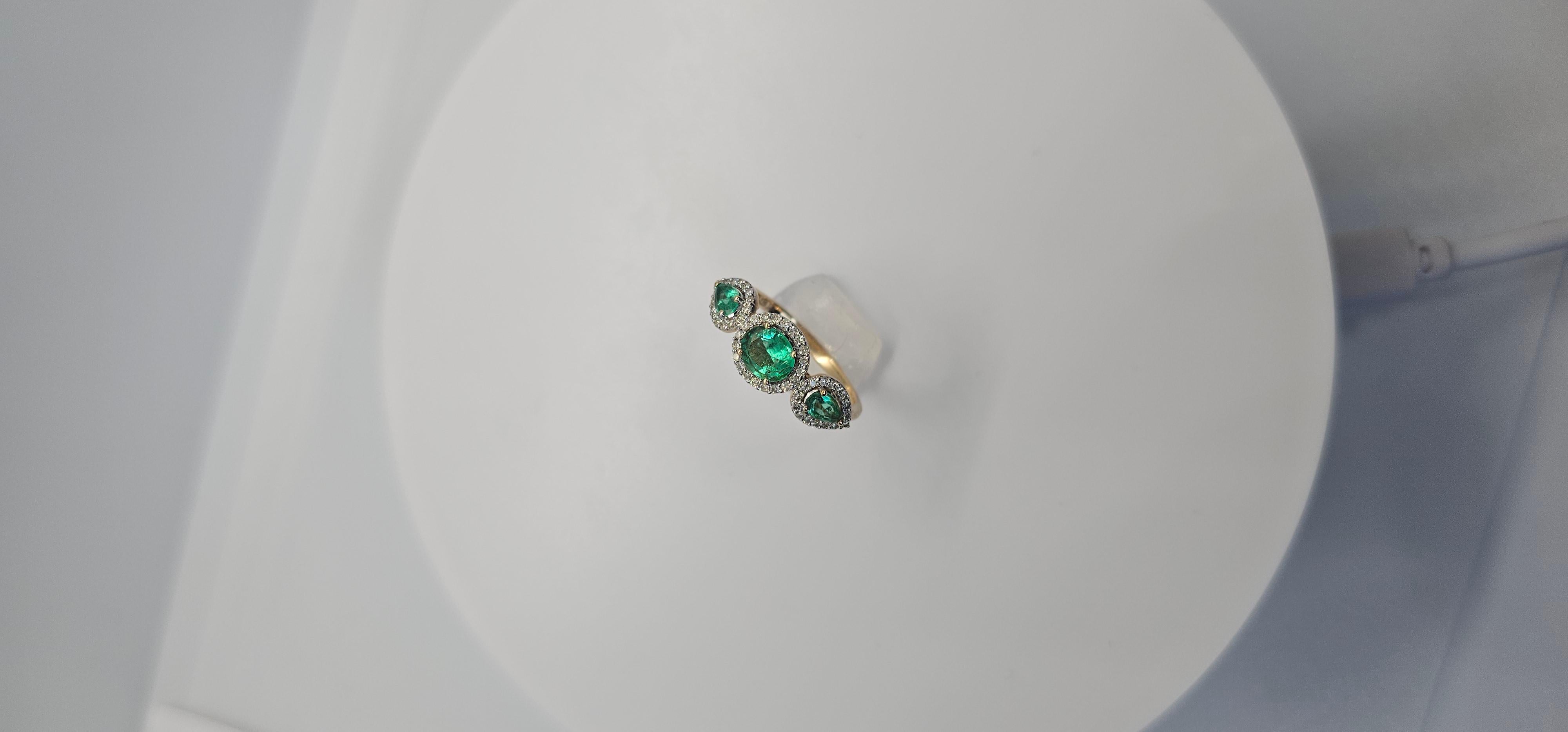 Ring size 6.5
Colombian emeralds 0.88 carats / 3 pieces
Natural Diamonds 0.29 carats / 52 pieces

Experience the pinnacle of elegance with this opulent three-stone halo ring, featuring 1.17 carats of rare Colombian emeralds and dazzling natural