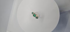 1.17 Carats Colombian Emeralds and Natural Diamond Three Stone Halo Ring
