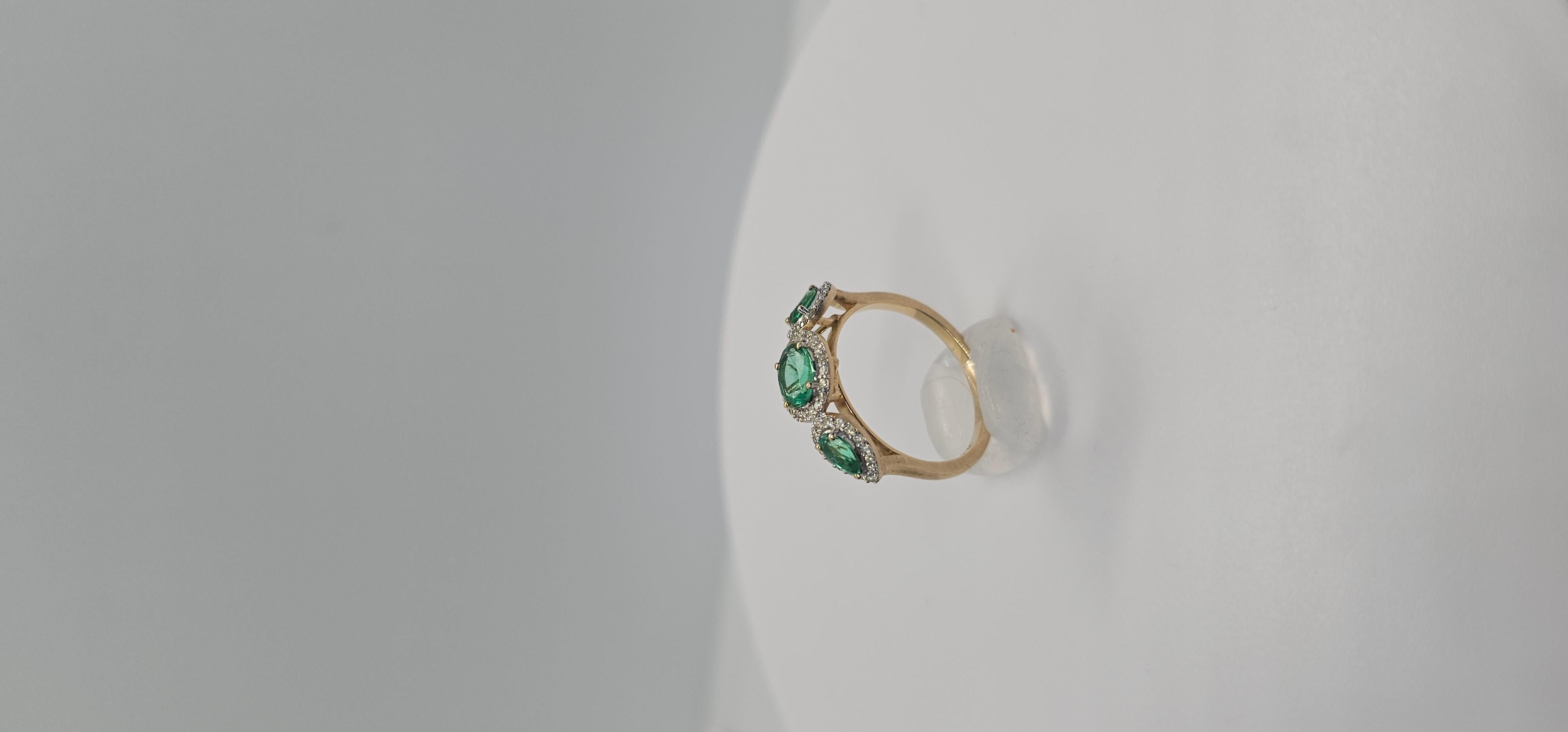 Oval Cut 1.17 Carats Colombian Emeralds and Natural Diamond Three Stone Halo Ring For Sale