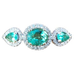 1.17 Carats Colombian Emeralds and Natural Diamond Three Stone Halo Ring