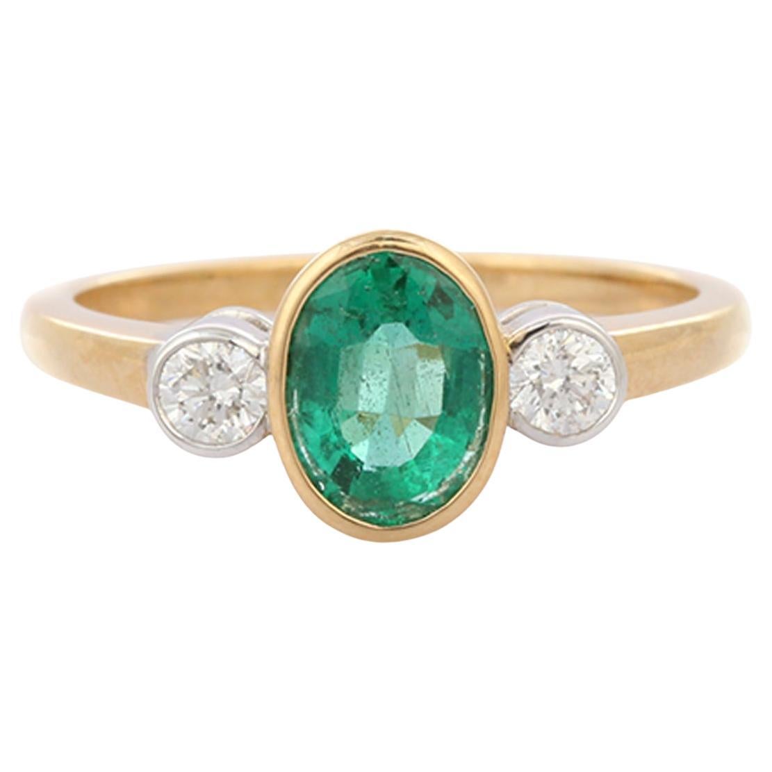 For Sale:  1.17 Ct Bezel Set Oval Emerald and Diamond in 18K Yellow Gold Three Stone Ring