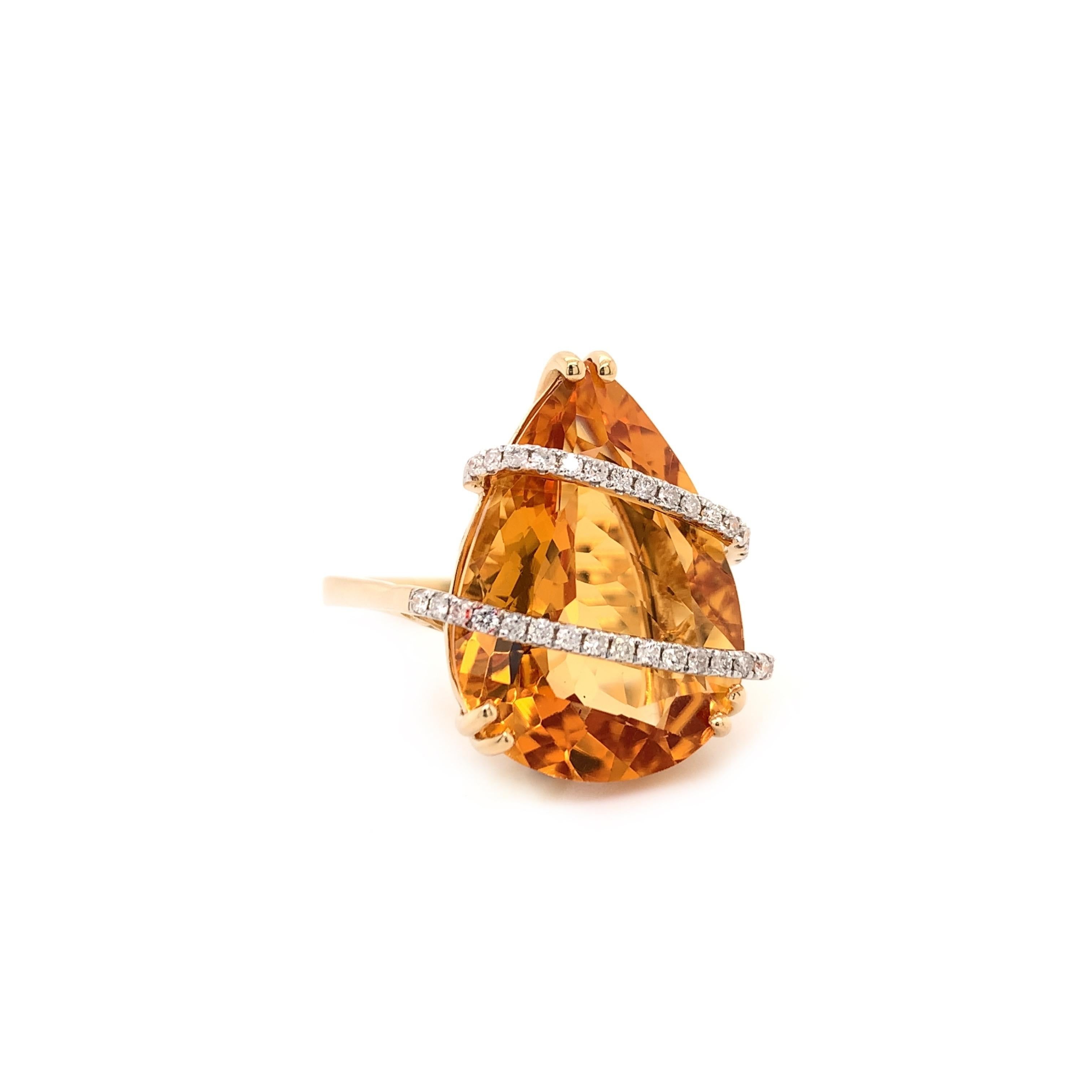  Stunning citrine cocktail ring. High brilliance, transparent, rich golden honey tone, pear shape faceted natural 11.70 carats citrine mounted in high profile open basket with 6 bead prongs, accented with 2 rows of round brilliant cut diamonds.