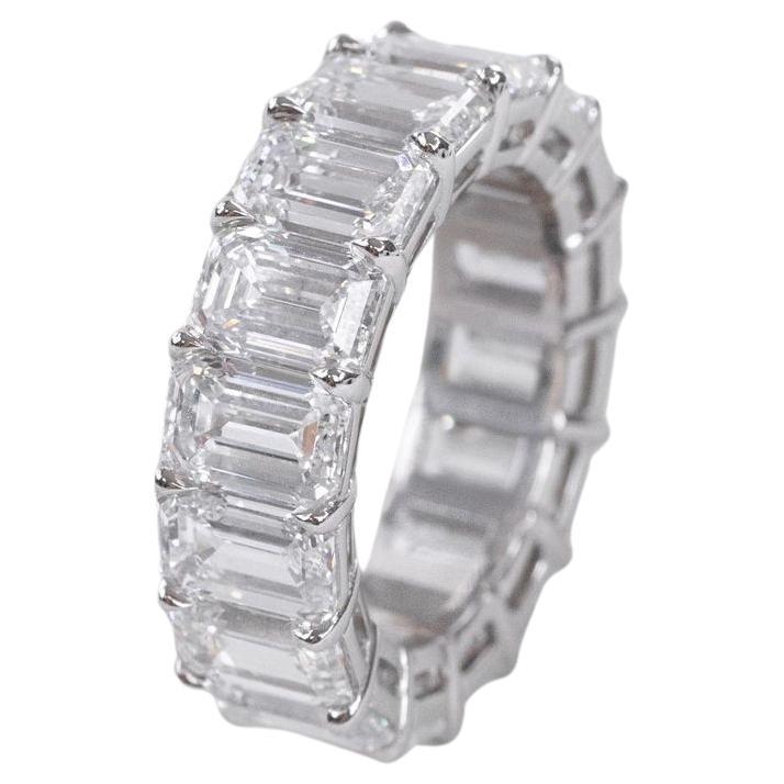 breathtaking eternity band, crafted from the finest platinum, lies a symphony of radiance and sophistication. Adorned with a total of 16 mesmerizing emerald-cut diamonds, each meticulously selected for their exceptional quality and brilliance, this