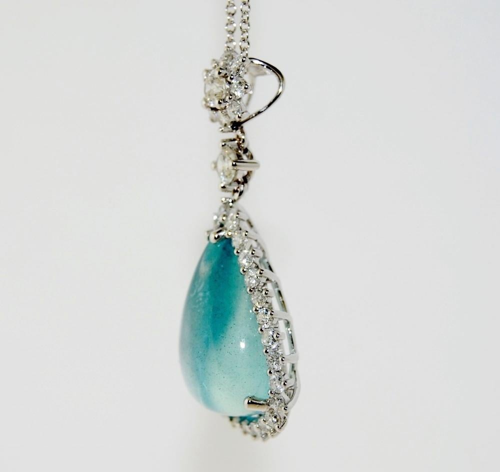 This 11.71 Carat Pear Shape Aquamarine Pendant Necklace is surrounded by 1.50 Carat Brilliant Round White Diamonds and mounted in 14 Karat White Gold.  The pendant length is 1.5 inches with 18 inches long chain included.