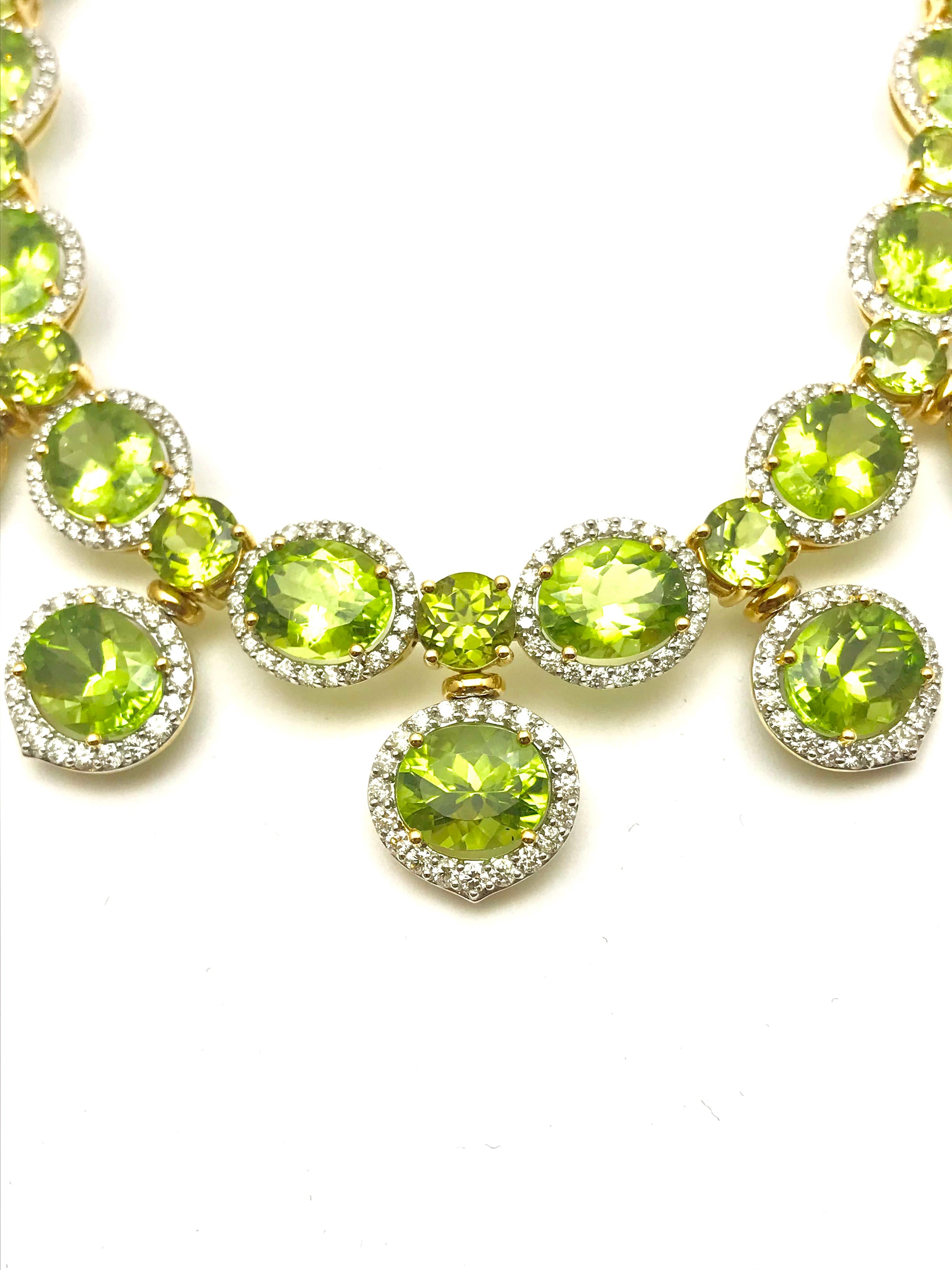 This stunning necklace contains 37 oval and round faceted Peridot totaling 117.19 carats, accompanied by 5.00 carats of round brilliant Diamonds.  The necklace is designed with the Diamonds in a single row around each oval Peridot on the front half
