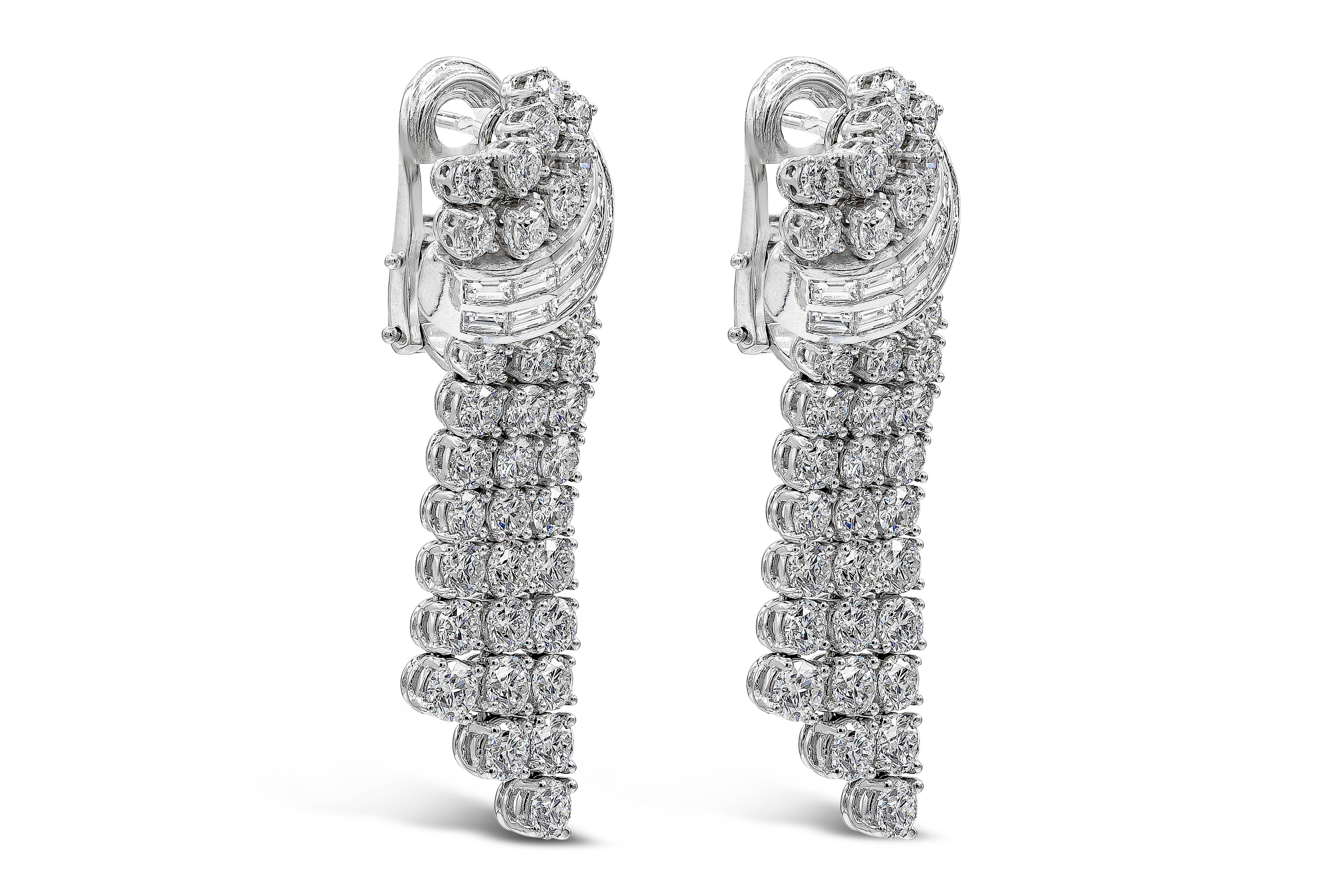 A fashionable pair of earrings showcasing a combination of baguette and round diamonds, set in an elegant drop design made in 18k white gold. Round diamonds weigh 10.04 carats total; baguette diamonds weigh 1.70 carats total. Diamonds are