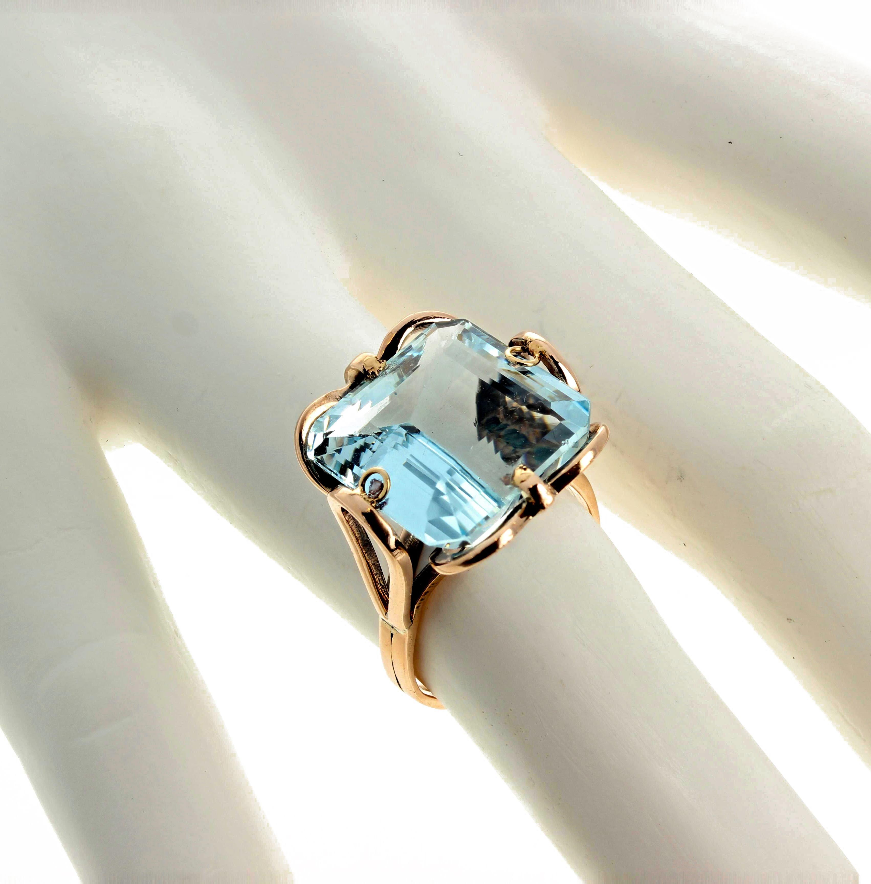 Glittering cushion cut 11.75 carat natural Aquamarine (15 mm x 14.5 mm) set in a unique 10 Kt yellow gold ring size 7 (sizable).  More from this jeweler by putting Gemjunky into your 1stDibs search bar.  
