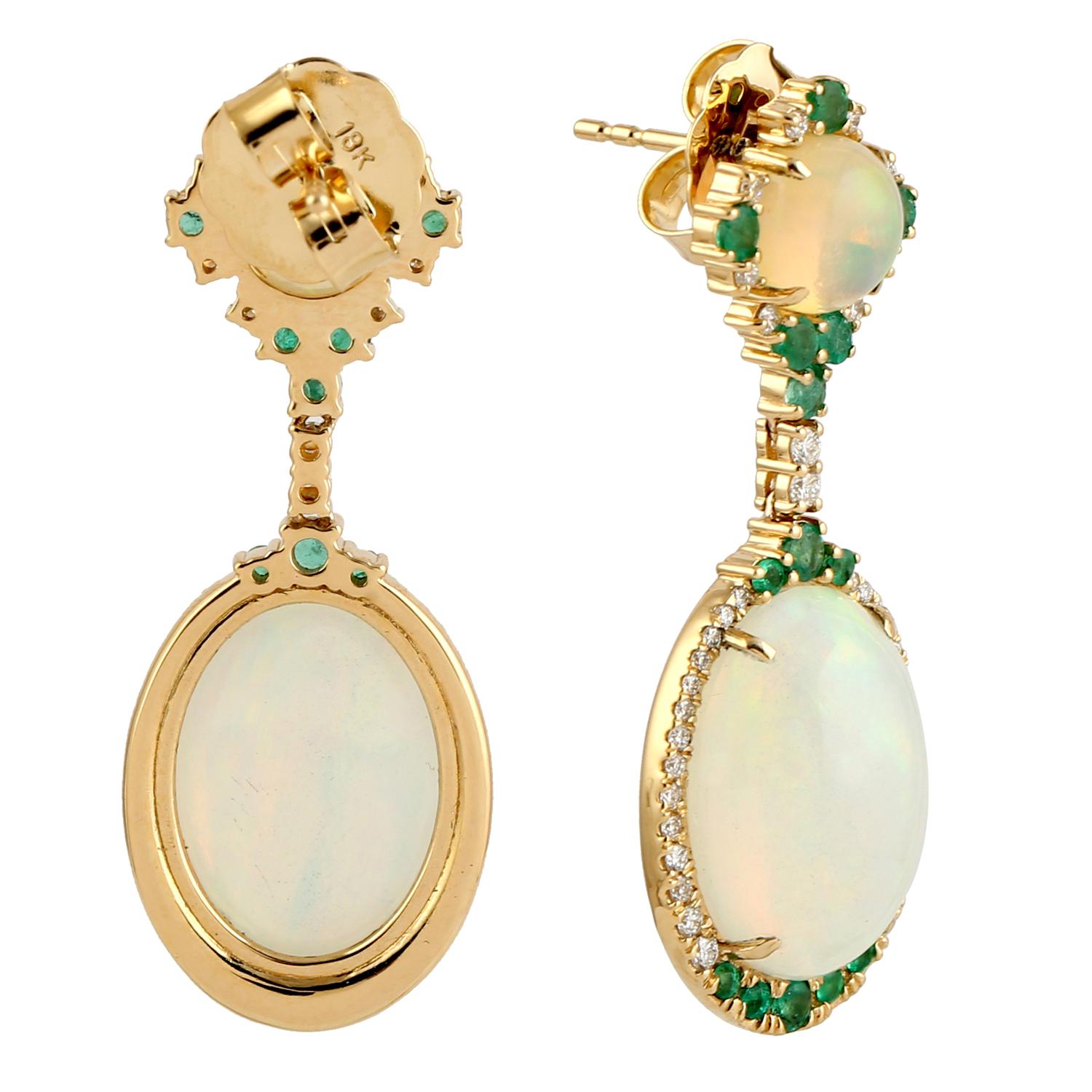 Cast in 14 karat gold. These earrings are hand set in 11.75 carats Ethiopian opal, 1.09 carats emerald, and .59 carats of sparkling diamonds. 

FOLLOW MEGHNA JEWELS storefront to view the latest collection & exclusive pieces. Meghna Jewels is