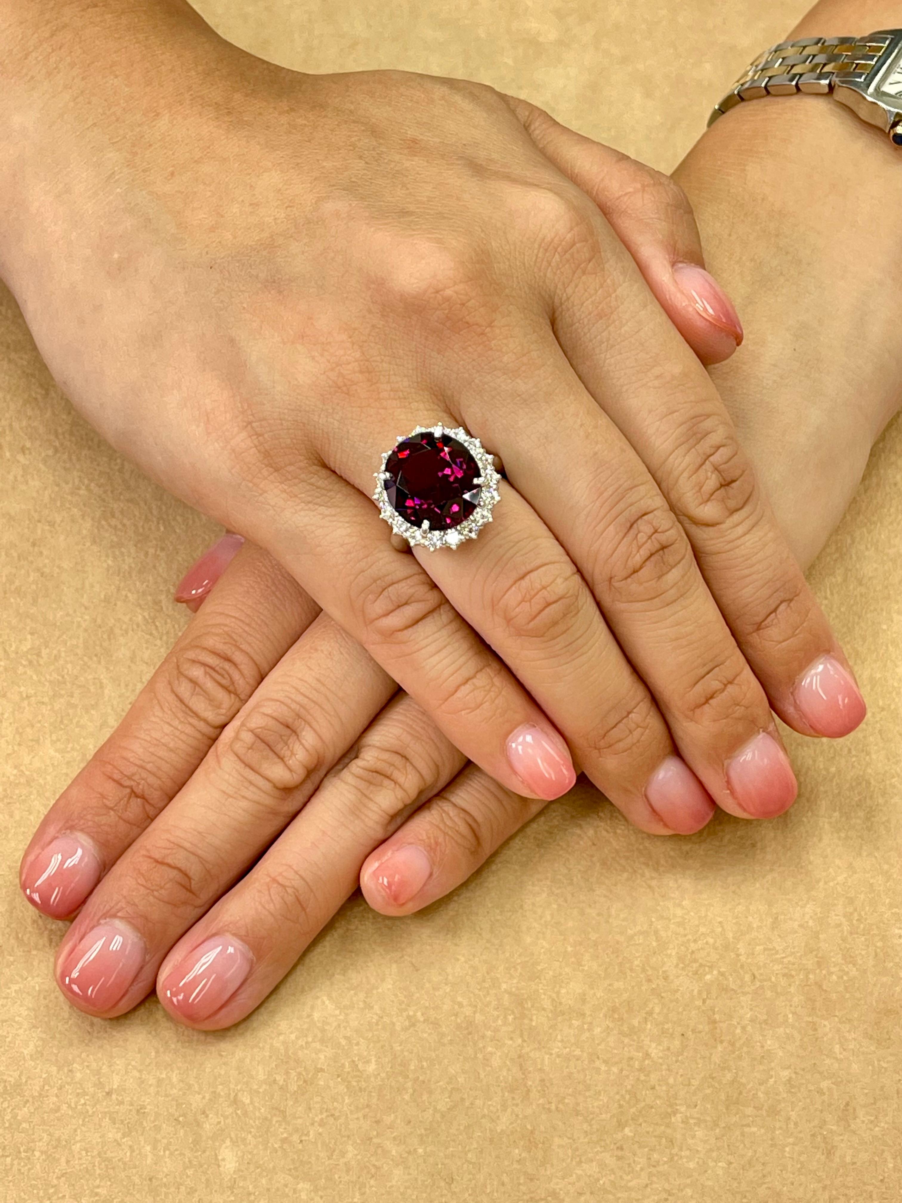 Please check out the HD video. Nothing much to say about this ring except we guarantee it to be much nicer than any of the photos or video. Here is an oversized Rhodolite Garnet ring (11.76cts) The ring is set in platinum and diamonds. There are