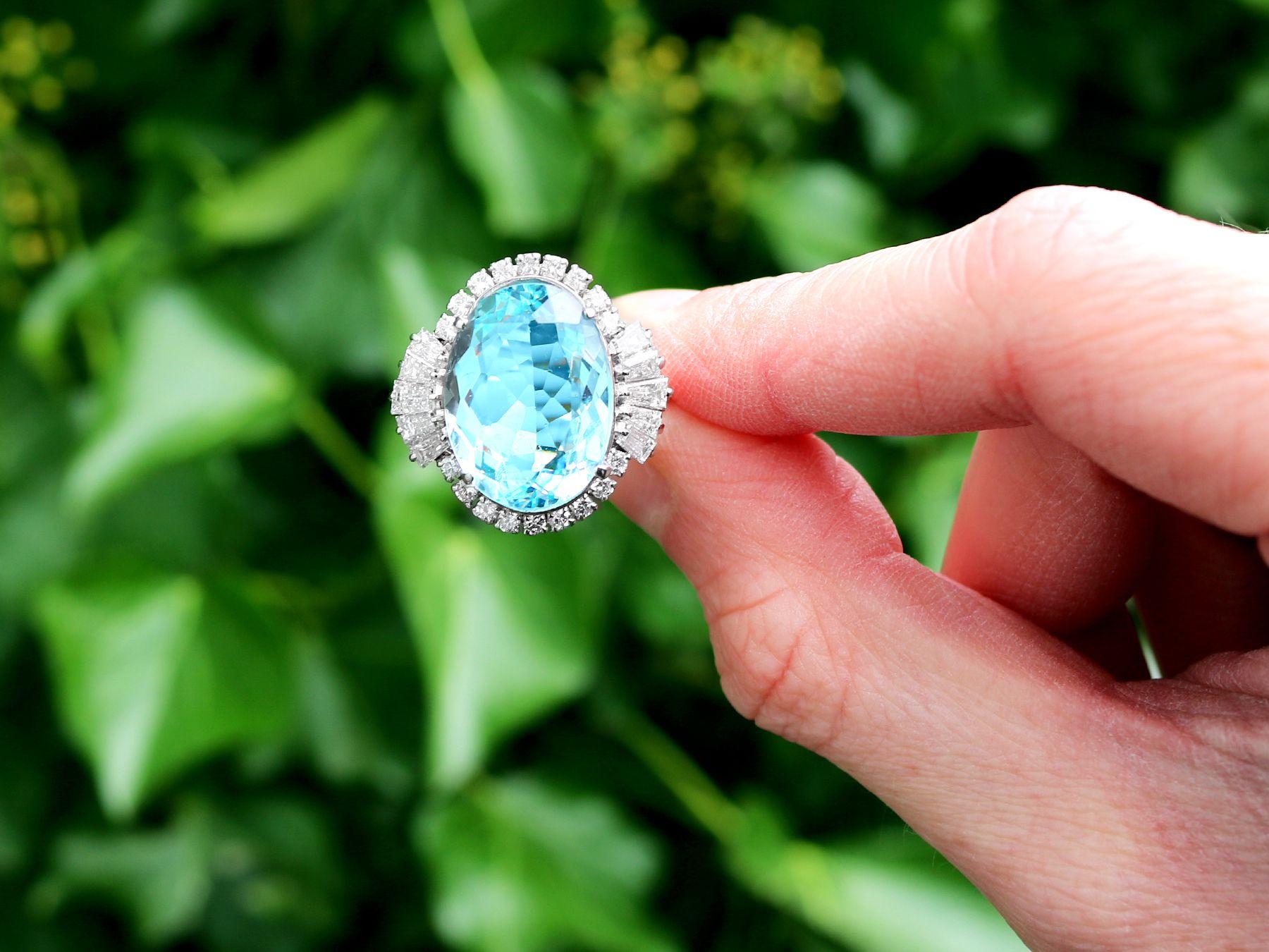 A stunning, fine and impressive 11.76 carat aquamarine and 1.45 carat diamond, platinum cocktail ring; part of our diverse gemstone jewelry and estate jewelry collections.

This stunning, fine and impressive aquamarine ring has been crafted in