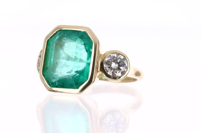 Modern 11.79tcw 18K Three Stone Colombian Emerald Cut & Round Diamond Engagement Ring