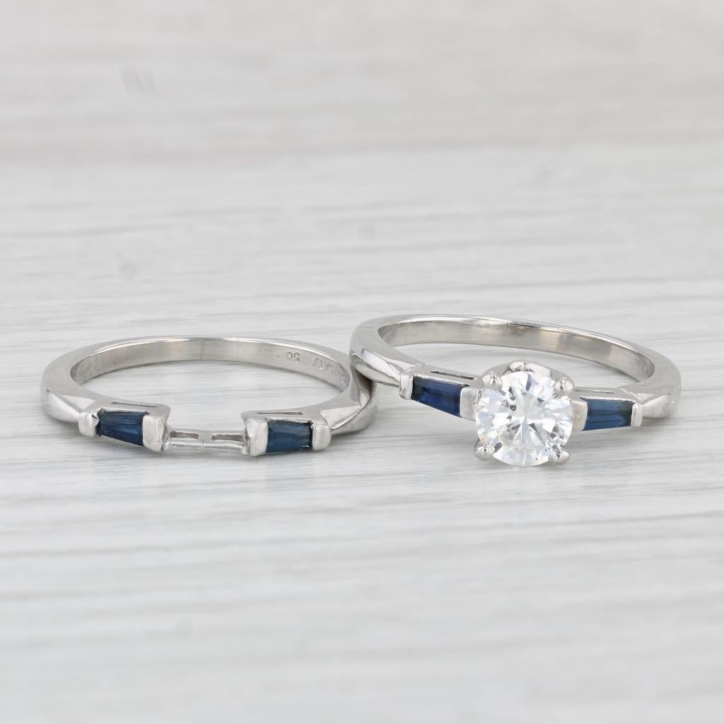 Gemstone Information: Natural Diamonds - 1.17ctw Total Carats
- Engagement -
Center
Carats - 0.79ct 
Cut - Round Brilliant
Color - F
Clarity - SI2
GIA - 6224953895

Accents
Natural Sapphires - 0.24ctw
Cut - Baguette
Color - Dark Blue
Treatment -