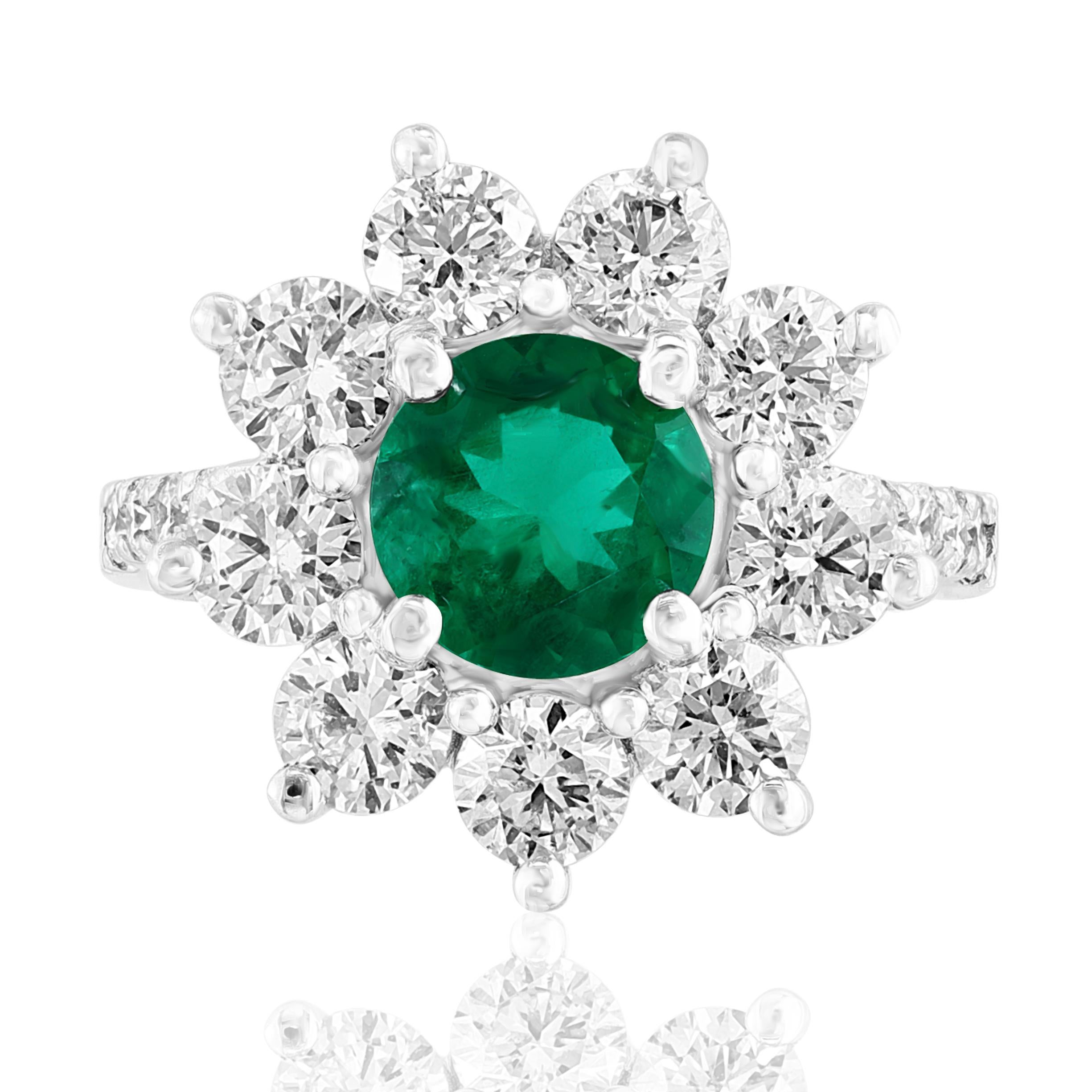 A stunning well-crafted engagement ring showcasing a 1.18-carat brilliant-cut vivid green emerald. Flanking the center diamond are perfectly matched brilliant cut 17 diamonds weighing 2.31 carat in total, set in a polished 14K White Gold mounting.