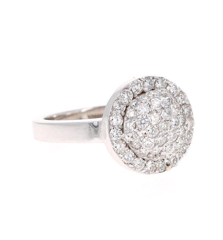 The gorgeous cluster of diamonds make this ring one-of-a-kind! 

This ring has 56 Round Cut Diamonds that weigh 1.18 Carats. The Clarity and Color of the diamonds are SI-F.

The ring is set in 14 Karat White Gold and weighs approximately 5.8 grams.