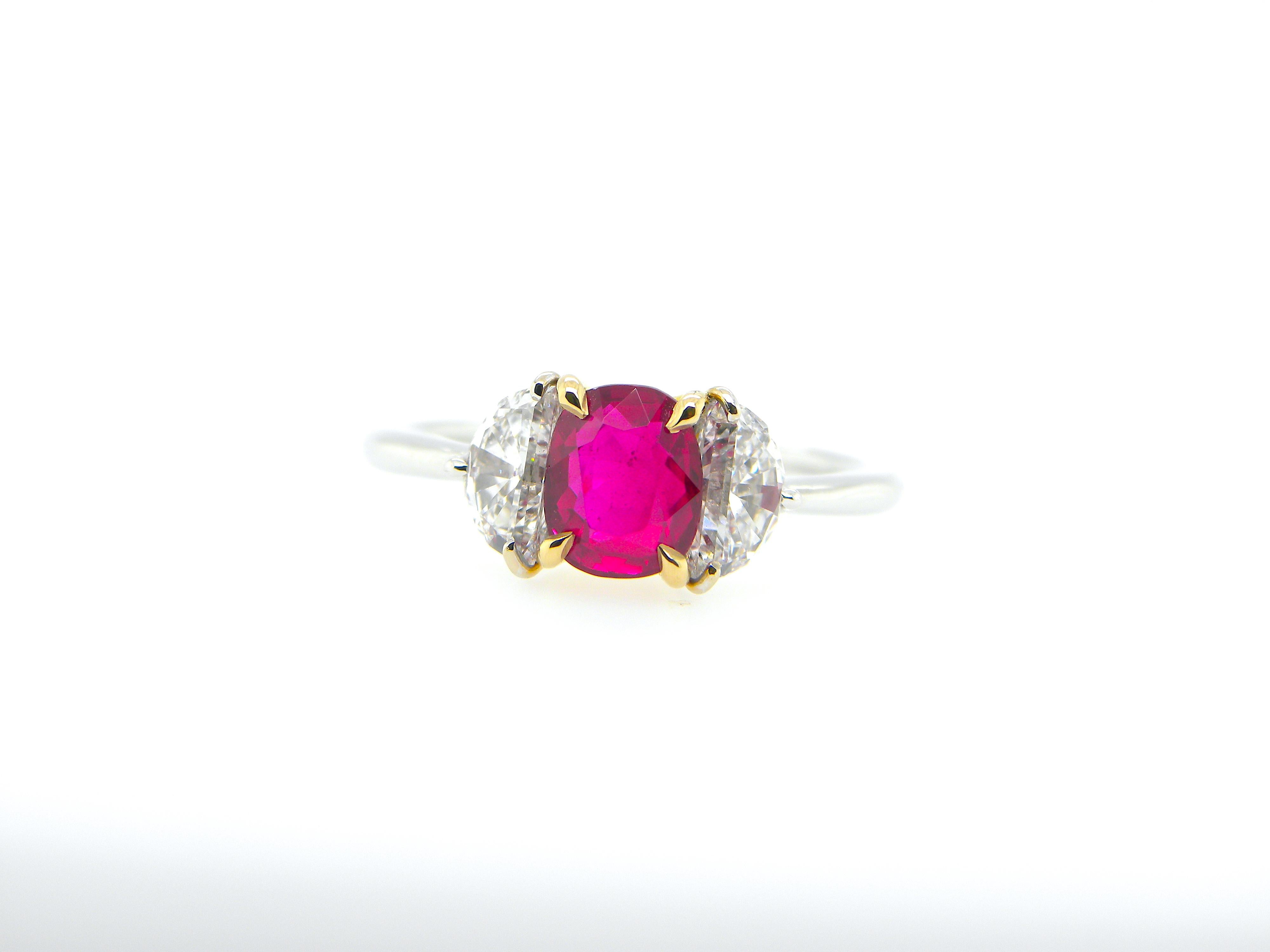 1.18 Carat GIA Certified Burma No Heat Pigeon's Blood Red Ruby and Diamond Ring:

A stunning three-stone ring, it features a very rare GIA certified unheated Burmese pigeon's blood red ruby weighing 1.18 carat flanked by super-white half-moon cut