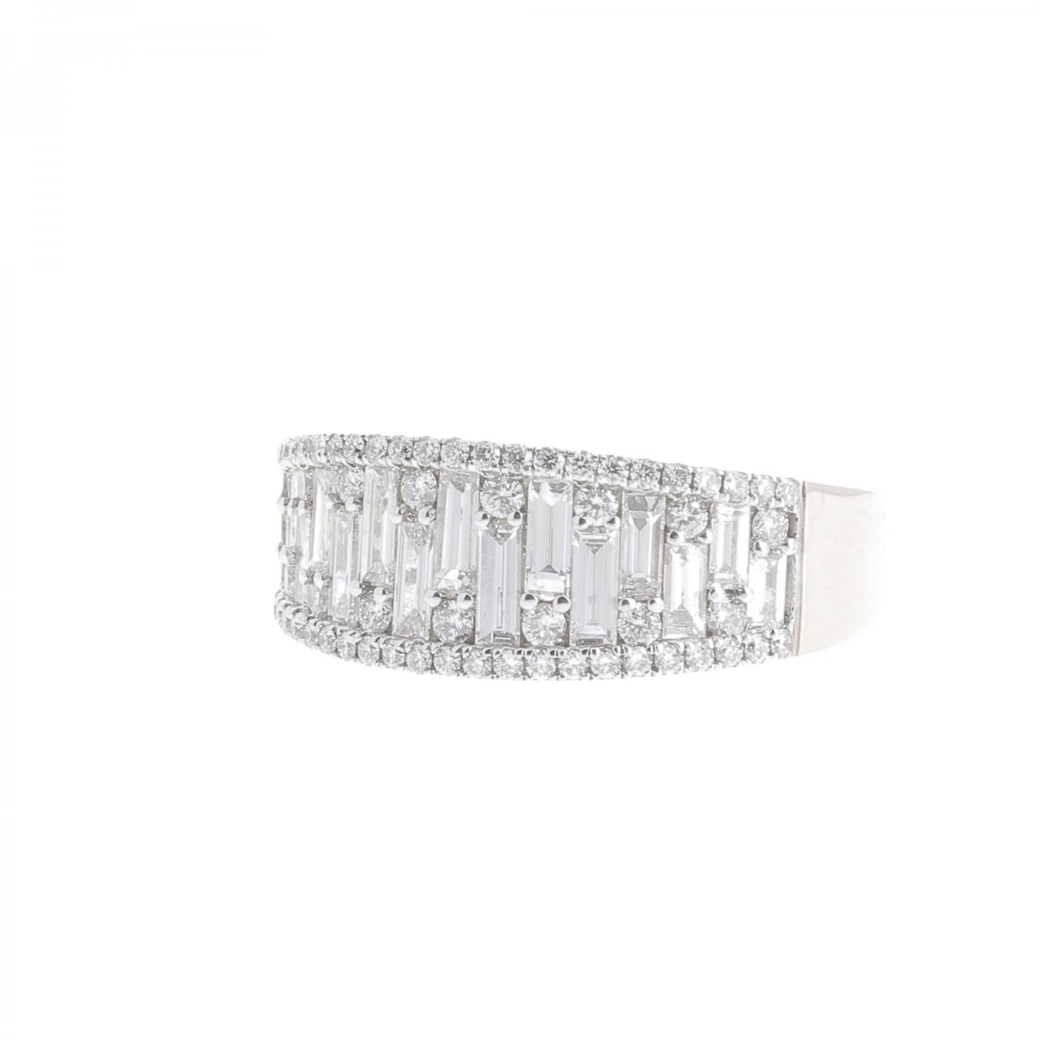 A wonderful Diamond Ring set with Round and Baguettes Diamonds weighing 1.18 Carats.
The Diamonds are GVS quality.
The Diamond Cocktail Ring is in 18K White Gold.
The ring weight 4.79 Grams.
The ring size is 6 ½ US and can be size
The Cocktail ring