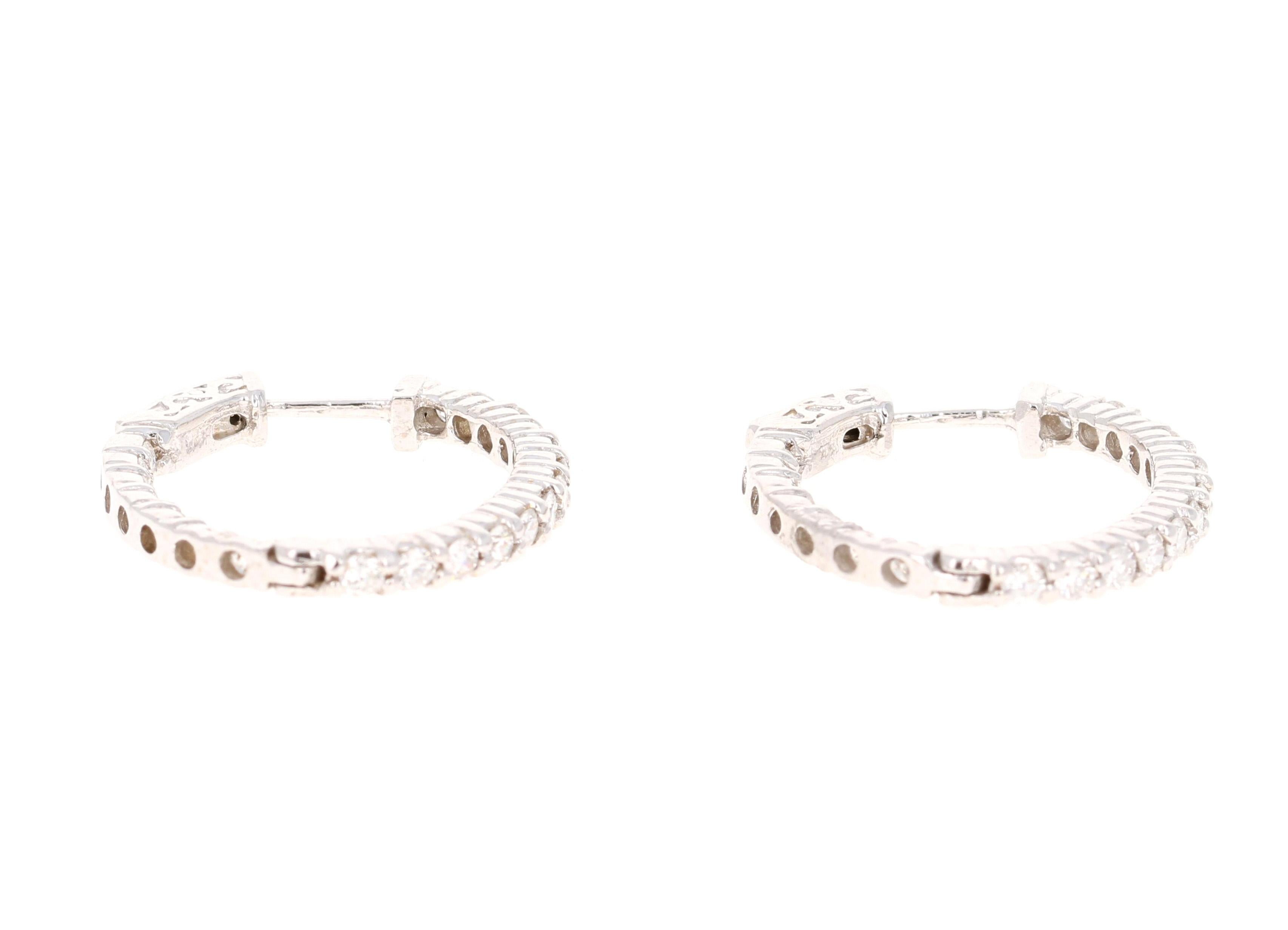 These gorgeous hoop earrings are ideal as everyday earrings or even for those special night outs. 

These earrings have 40 Round Cut Diamonds aligned both on the inside and outside of the hoop and weigh a total of 1.18 Carats. (Clarity: SI, Color: