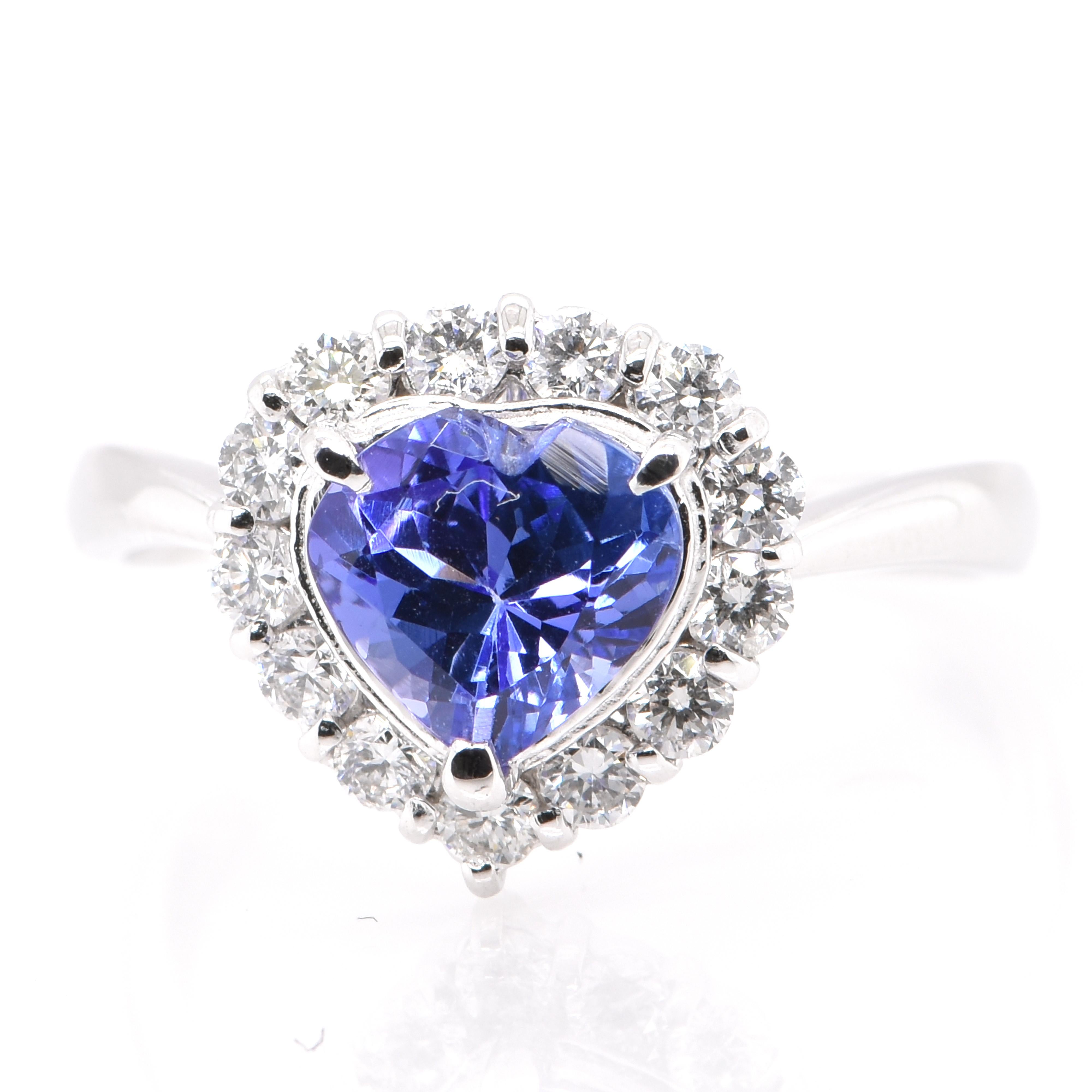 A beautiful engagement ring featuring a 1.18 Carat Natural Tanzanite and 0.38 Carats of Diamond Accents set in Platinum. Tanzanite's name was given by Tiffany and Co after its only known source: Tanzania. Tanzanite displays beautiful pleochroic