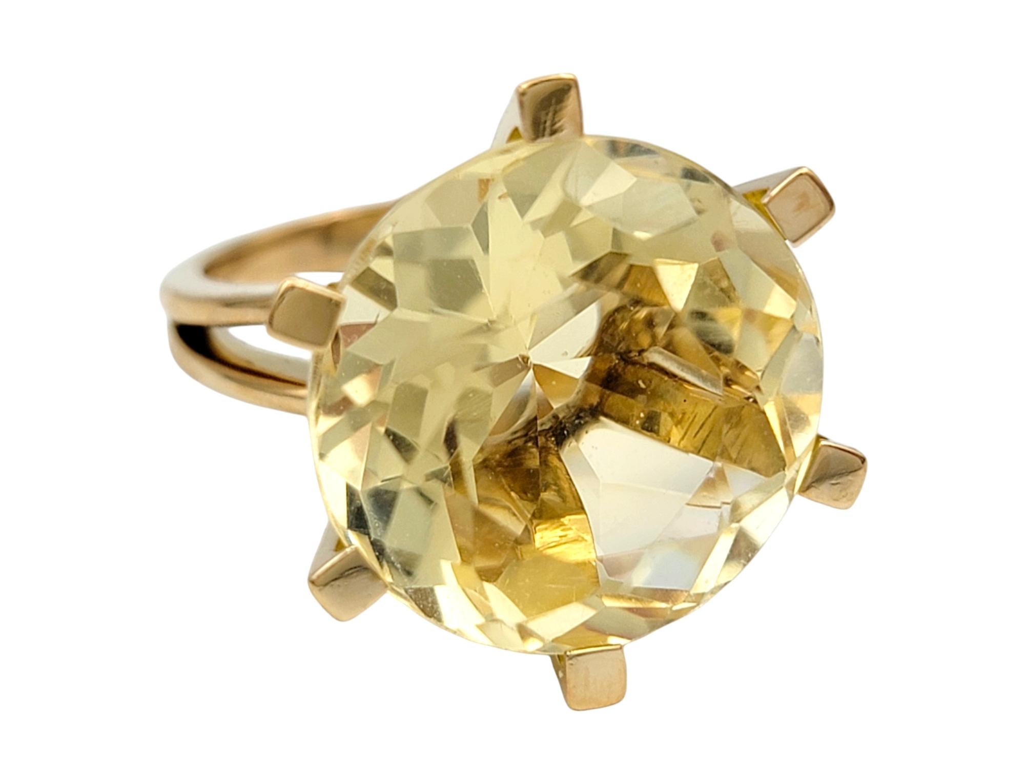 Ring Size: 6

Exuding warmth and radiance, this statement ring is a stunning showcase of elegance and sophistication. Set in 14 karat yellow gold, the centerpiece of this ring is a breathtaking 11.8 carat round citrine, captivating the eye with its