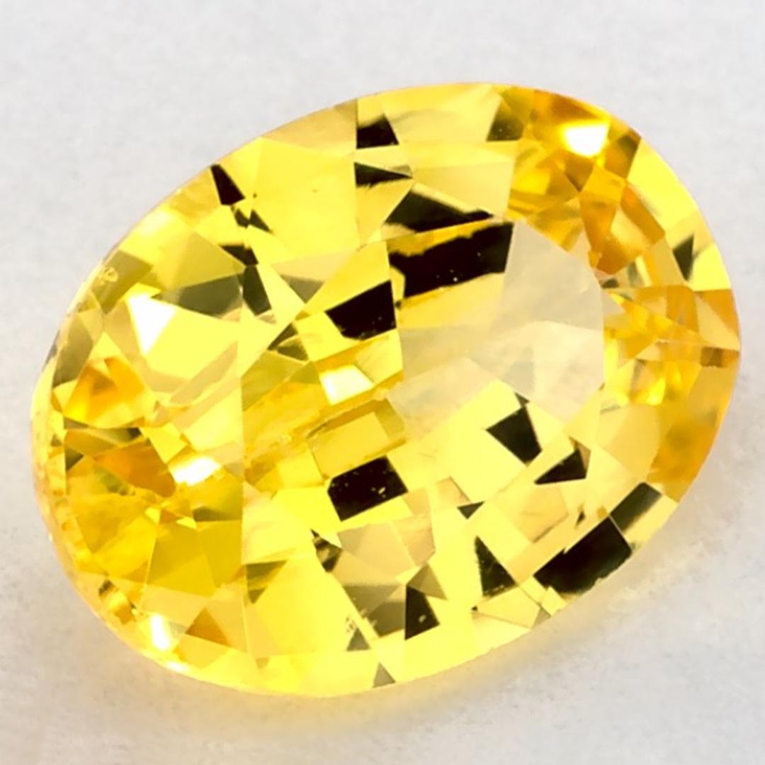 This natural Yellow sapphire offers elegance and sophistication. With its rich color saturation and precise cutting, it is the perfect centerpiece for an engagement ring or luxury jewelry design.

This sapphire originates from Sri Lanka (Ceylon),