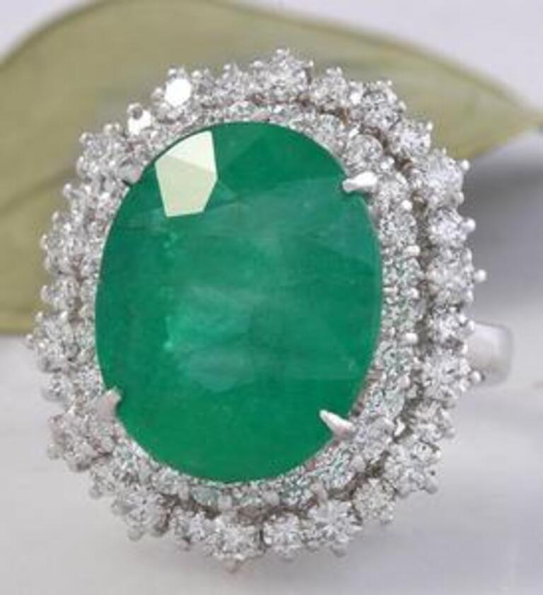 11.80 Carats Natural Emerald and Diamond 18K Solid White Gold Ring

Total Natural Oval Shaped Emerald Weights: Approx. 10.00 Carats

Emerald Measures: 16.00 x 13.00mm

Natural Round Diamonds Weight: 1.80 Carats (color G-H / Clarity SI1-SI2)

Ring