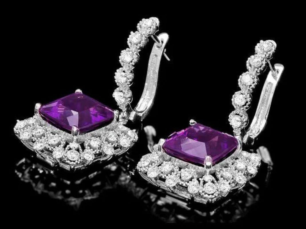 11.80ct Natural Amethyst and Diamond 14K Solid White Gold Earrings

Total Natural Cushion Amethyst Weight: 9.90 Carats 

Amethyst Measures: Approx.  10 x 10 mm

Total Natural Round Cut White Diamonds Weight: Approx.  1.90 Carats (color G-H / Clarity