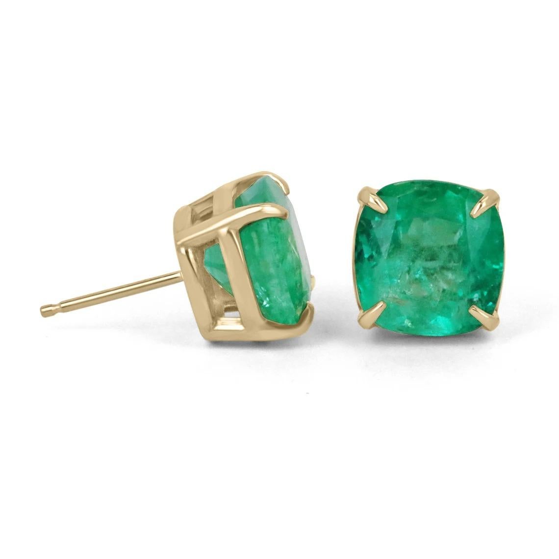 Featured here is a stunning pair set of cushion-cut emerald studs, skillfully handmade in fine solid 18K yellow gold. Displayed are two large spectacular natural Colombian emeralds with good transparency, color and luster accented by a secure