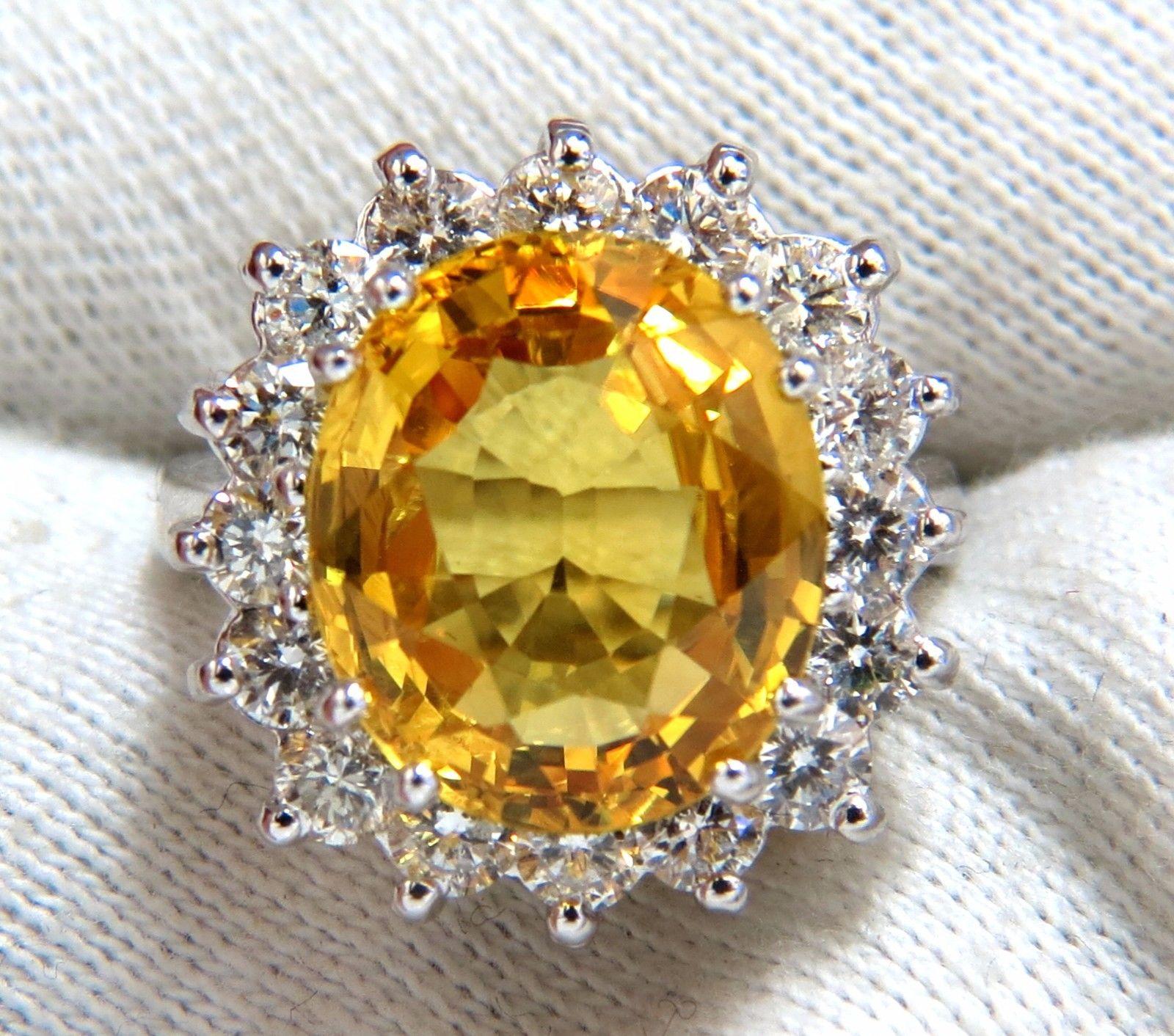 Canary Yellows.

 10.01ct Natural  Yellow Sapphire Ring

Full cut oval brilliant 

Clean Clarity & Transparent



1.80ct. Diamonds.

Rounds Full cuts 

G-color Vs-2 clarity.

  14kt. white gold

10 grams

Ring Current size: 6.5

(Free Resize