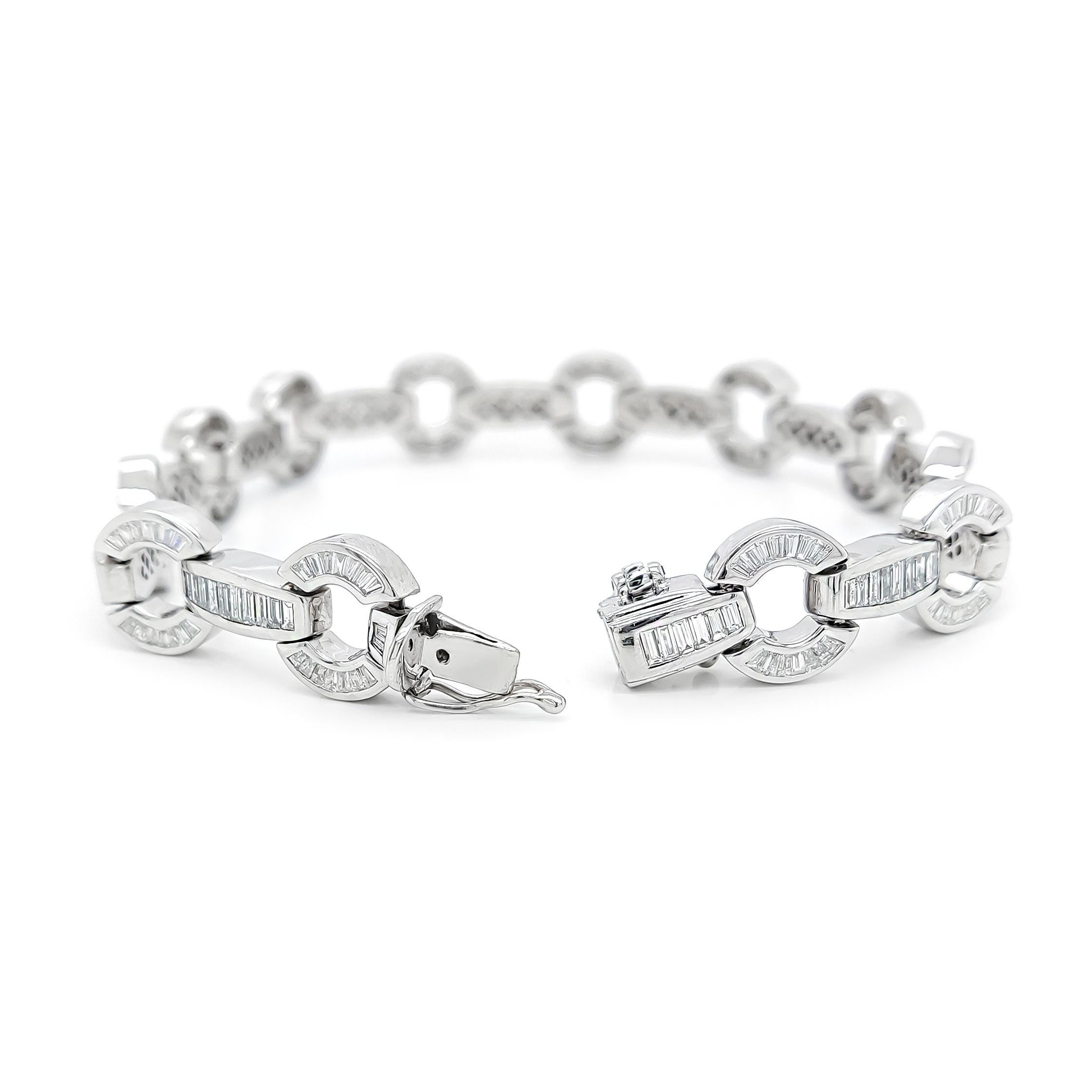 FOR CUSTOMERS FROM THE USA NO VAT

This stunning bracelet features 273 natural diamonds in a tapered baguette shape, with a total carat weight of 11.82 carats and a color grade of D-E. Crafted from 14-karat white gold, the bracelet weighs 32.40