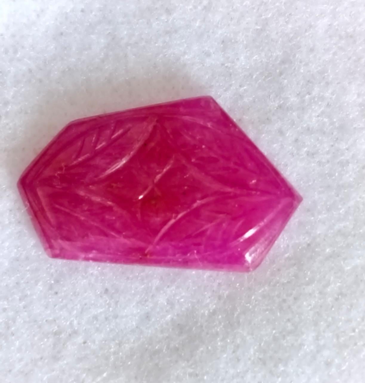 Natural Red Ruby Fancy Carving Fancy Gemstone.
11.82 Carat with a elegant Red color and excellent clarity. Also has an excellent fancy carving with ideal polish to show great shine and color . It will look authentic in jewelry. The dimensions of the