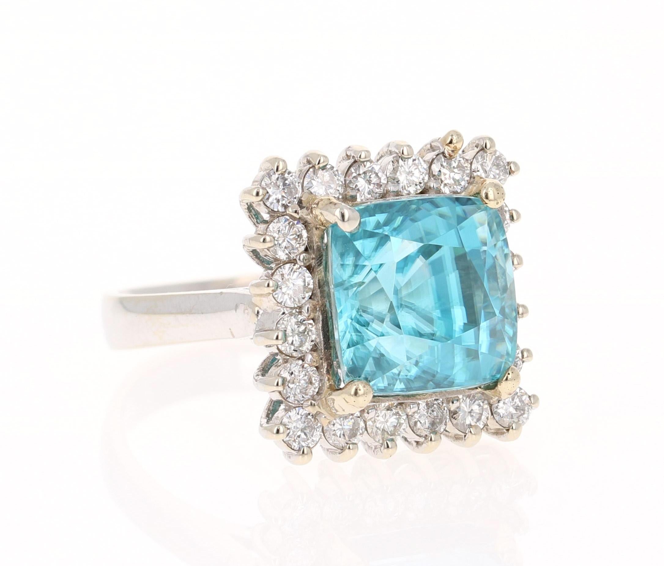 A Dazzling Blue Zircon and Diamond Ring! Blue Zircon is a natural stone mined in different parts of the world, mainly Sri Lanka, Myanmar, and Australia. 

This Square Cut Blue Zircon is 10.93 Carats and is surrounded by 20 Round Cut Diamonds that