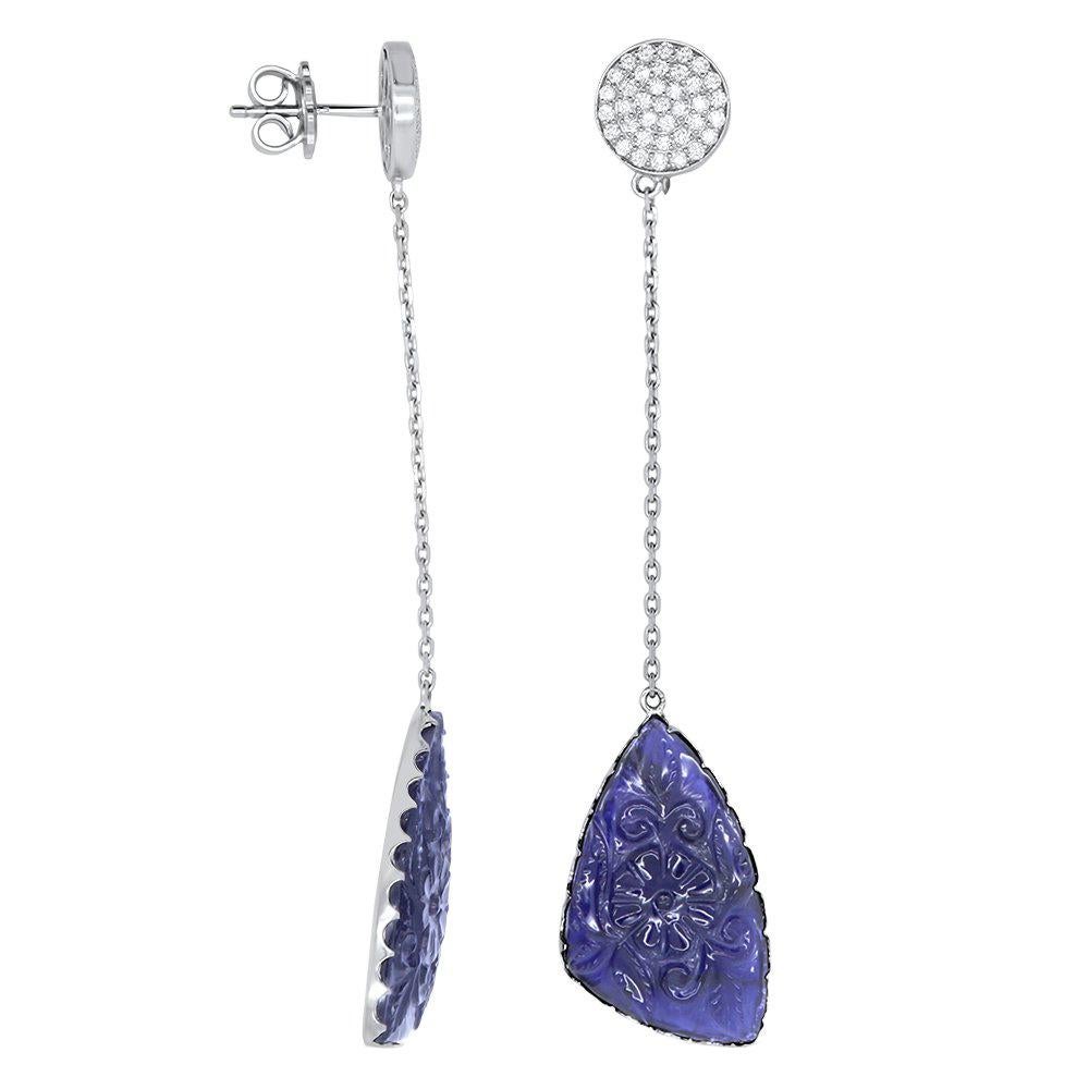 Material: 14k White Gold
Gemstone: 2 Carved Pear Shaped Iolite Gemstones at 11.84 Carats
Diamond: 72 Brilliant Round Diamonds at 0.72 Carats - SI Quality / H-I Color
Length: 74 mm

Pair this with our Pear Shaped Carved Iolite and White Diamond Ring