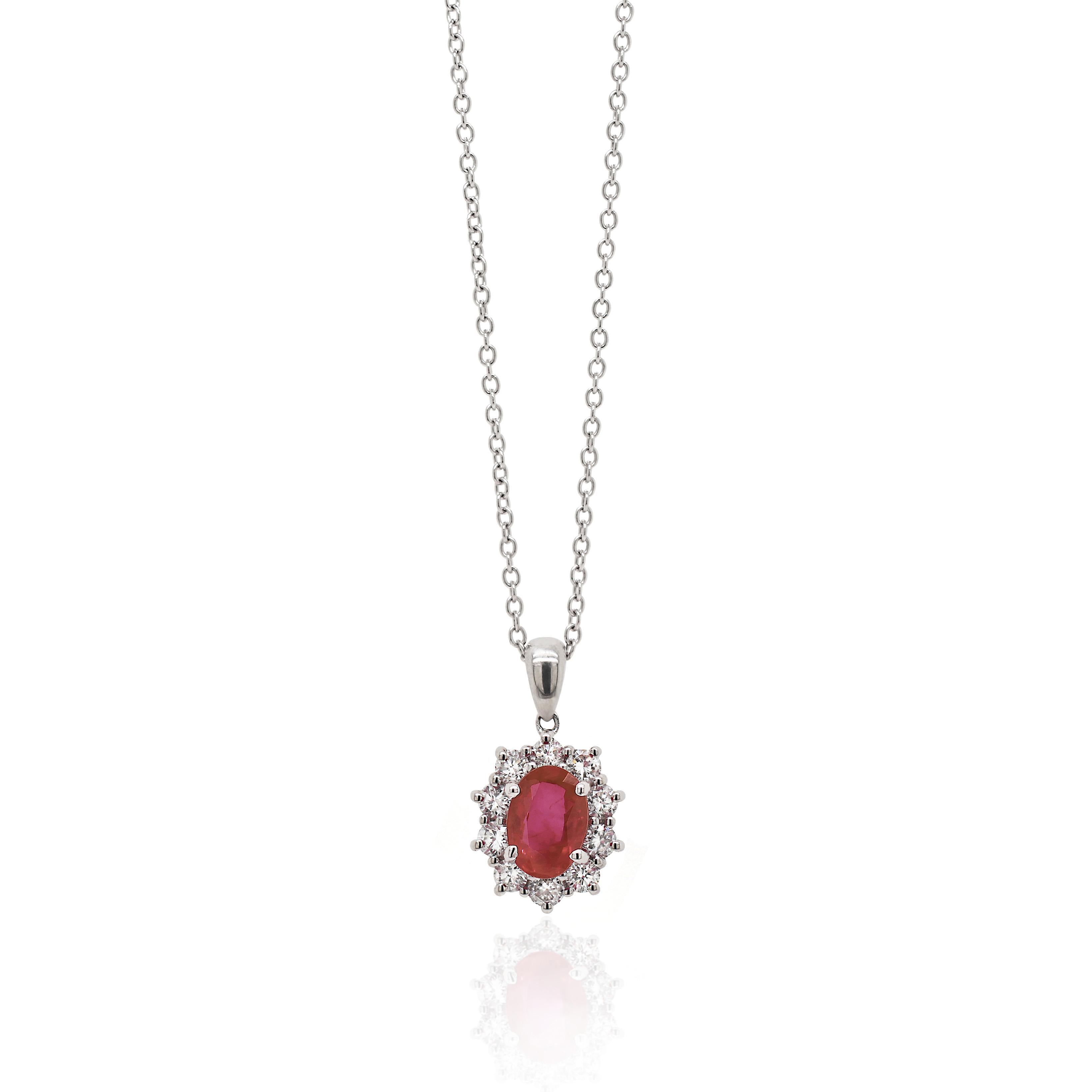 Pendant featuring a beautiful oval red ruby weighing 1.18ct set in a four claw open back setting. The ruby is surrounded by 10 fine quality round brilliant cut diamonds weighing a total of 0.50ct all claw set in 18ct white gold. 