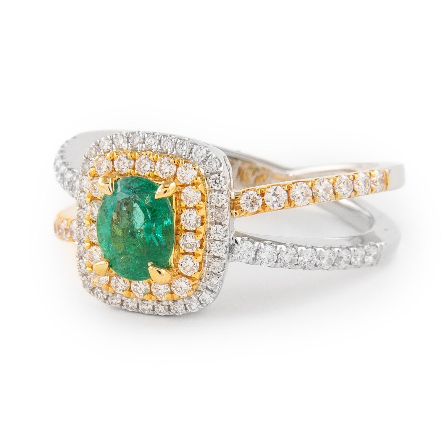 Beautiful emerald and diamond halo ring.
1.18 carats total gemstone weight.
0.62 carat oval shape emerald, approximately F2. Complimented by 82 round brilliant diamonds, 0.56 carats, F/G color and VS clarity. 14k white and yellow gold, 6.07 grams,