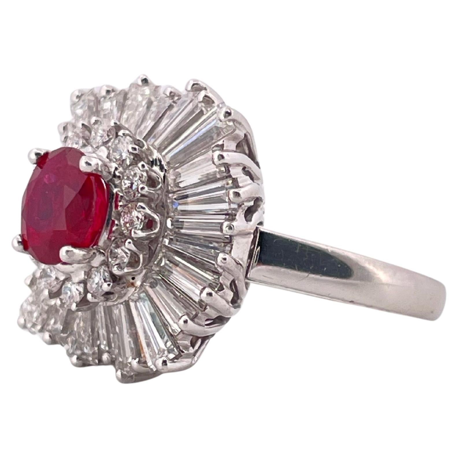 This exquisite platinum ring and pendant combination showcases timeless elegance and versatility. At its center rests a vibrant 1.18 carat natural corundum oval ruby, prized for its rich red hue and brilliance. Surrounding the ruby is a striking