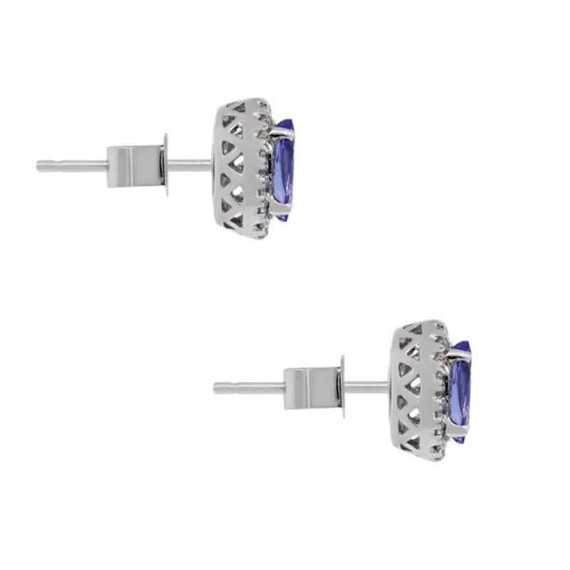 Style: Halo Stud Earrings
Material: 14k White Gold
Gemstone Details: Approximately 1.18ctw Tanzanite gemstones
Diamond Details: Approximately 0.15ctw of Round brilliant diamonds, diamonds are G/H in color and SI in clarity.
Earring Measurements: