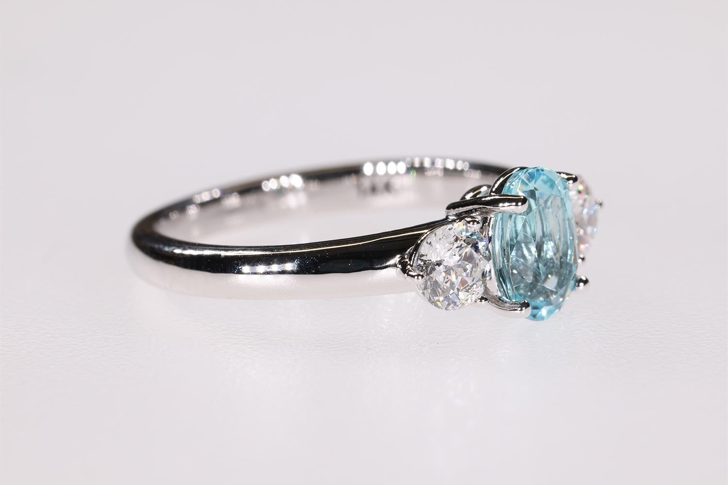 Oval Cut 1.19 Carat Blue Paraiba Tourmaline & Sirius Star 3 stone Diamond Engagement Ring For Sale