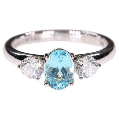 1.19 Carat Blue Paraiba Tourmaline & Sirius Star 3 stone Diamond Engagement Ring