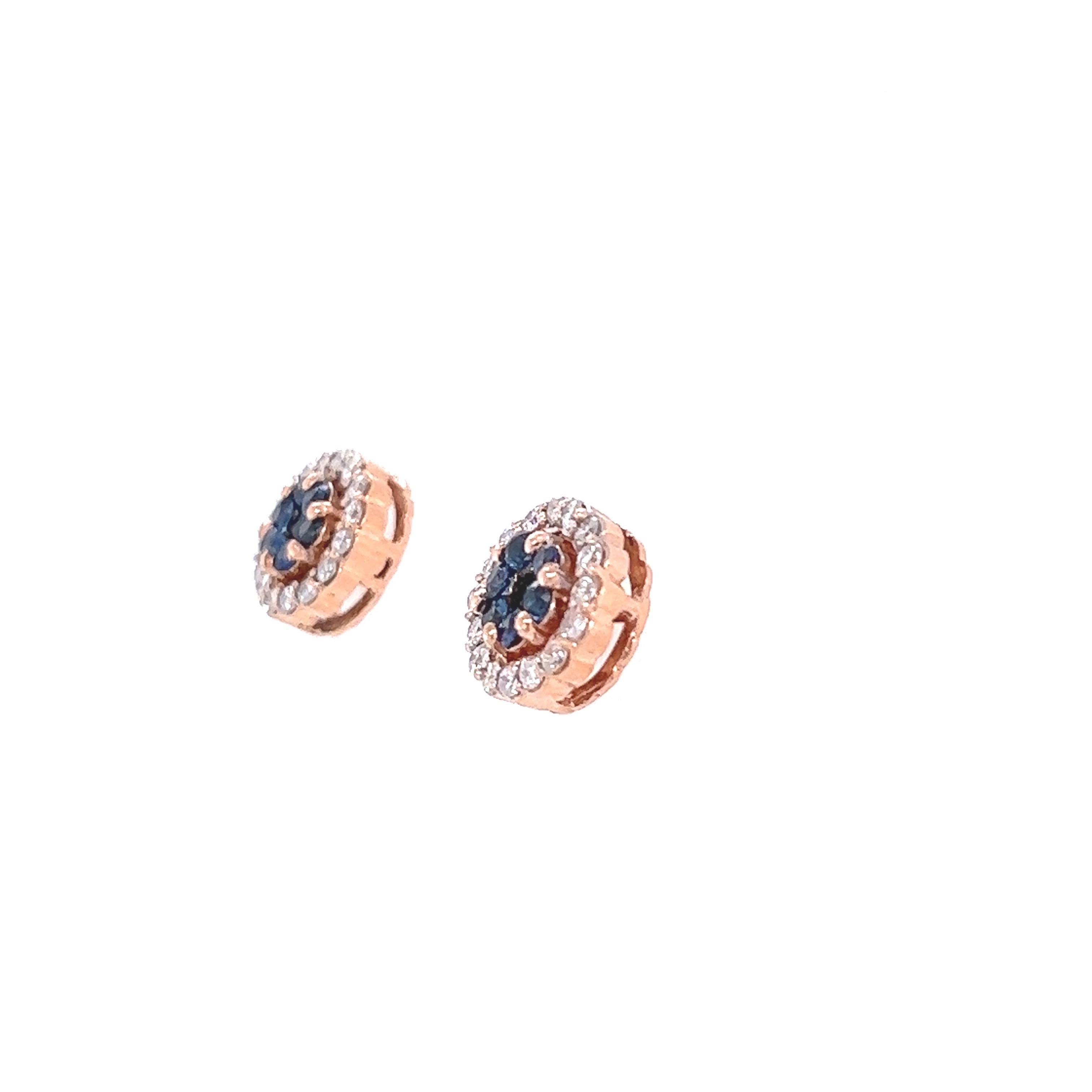 These earrings have 14 Natural Round Cut Sapphires that weigh 0.65 carats and have 32 Round Cut Diamonds that weigh 0.54 Carats. The total carat weight of the earrings are 1.19 carats. 
The diamonds have a clarity and color of SI-F
They are set in
