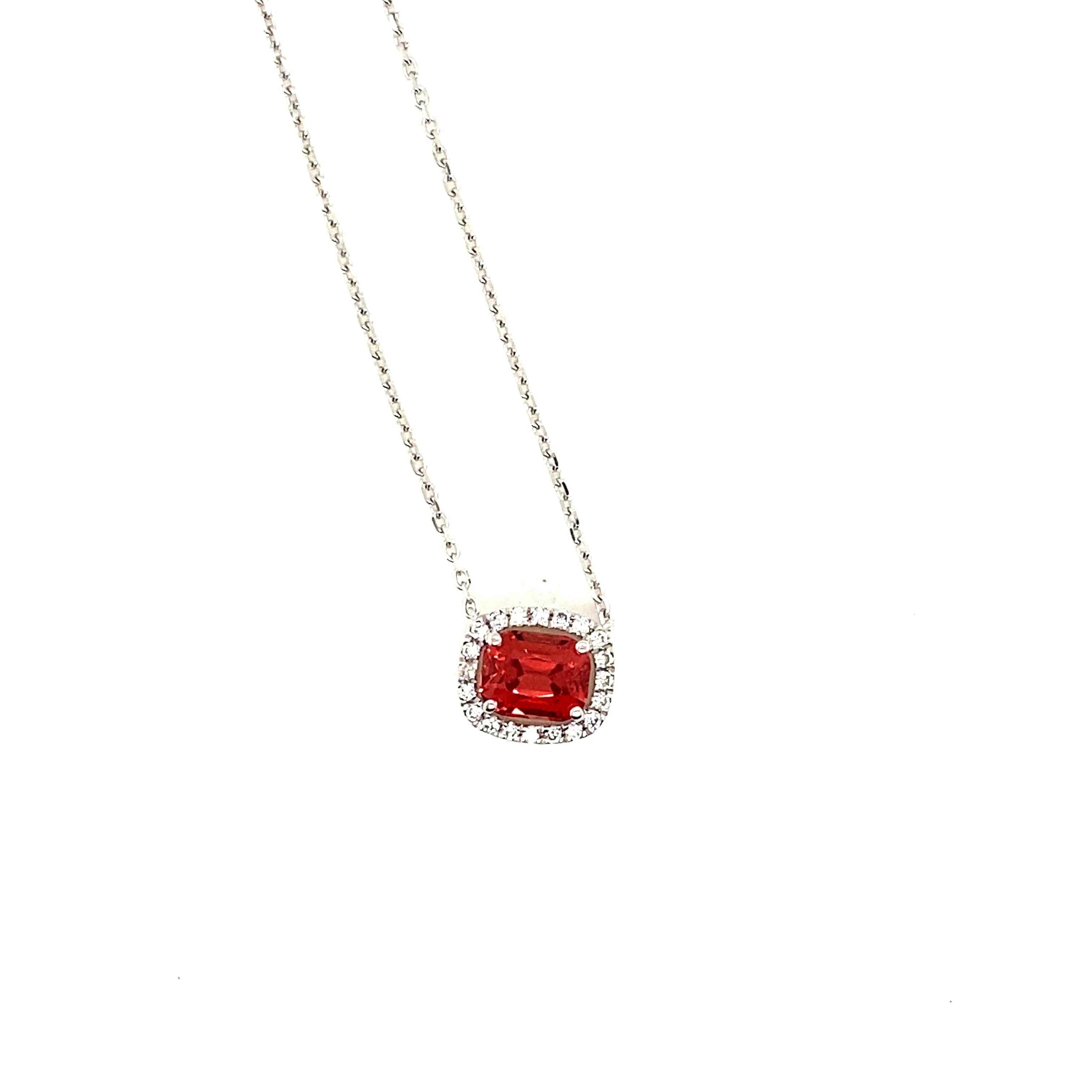 1.19 Carat Cushion-Cut Burma No Heat Spinel and White Diamond Pendant Necklace:

A beautiful pendant necklace, it features a 1.19 carat cushion-cut unheated Burmese spinel in the centre surrounded by a halo of white round-brilliant cut diamonds