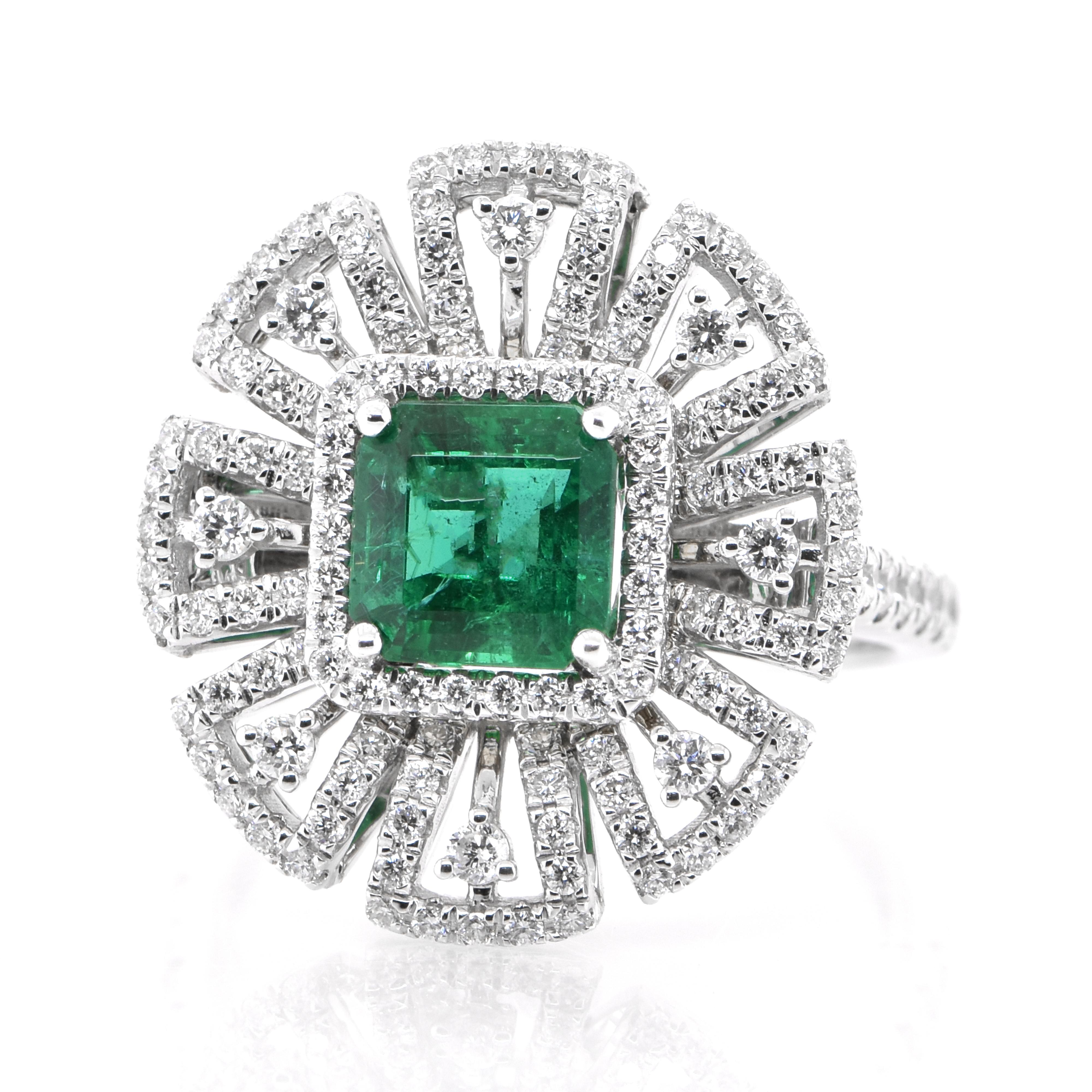 A stunning ring featuring a 1.19 Carat Natural Emerald and 0.82 Carats of Diamond Accents set in 18 Karat White Gold. People have admired emerald’s green for thousands of years. Emeralds have always been associated with the lushest landscapes and
