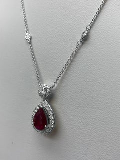 1.19 Carat Oval Cut Ruby and Diamond Halo Pendant in 14K White Gold