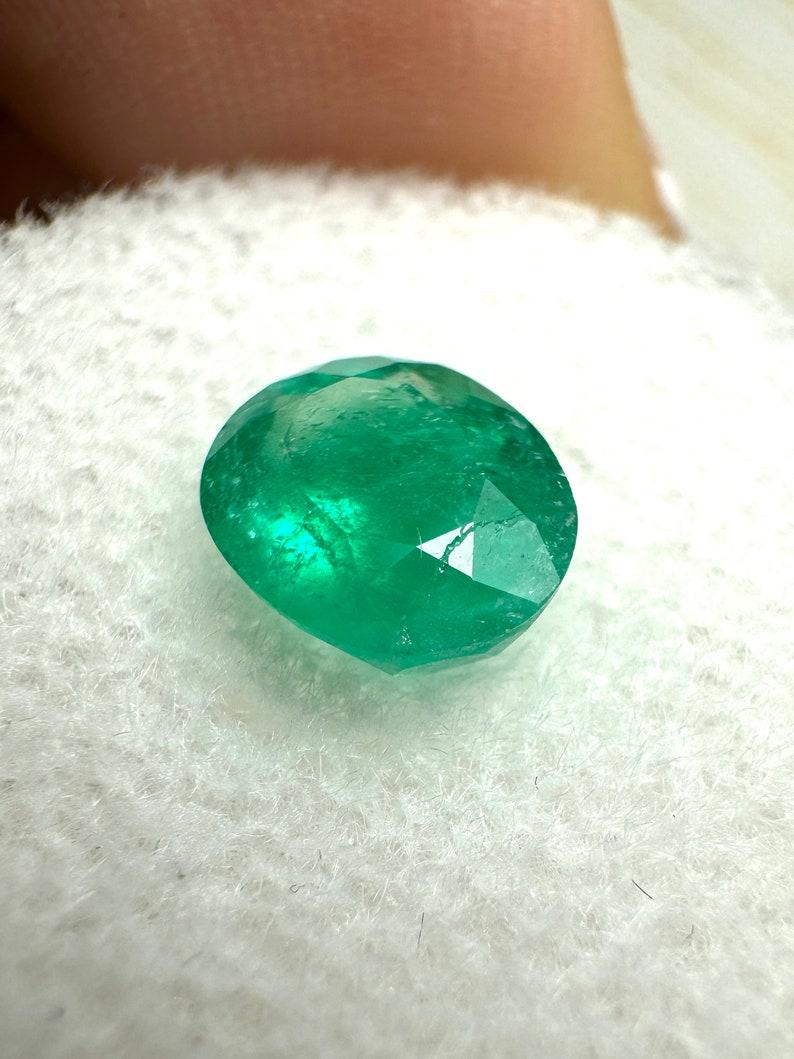 Stone: Emerald
Weight: 1.19-carats
Shape: Oval Cut
Clarity: Semi-Transparent
Luster: Good
Color: Medium Dark Green
Measurements: 7.65mm x 6.40m x 4.44mm
Geographic Origin: Colombia
Treatment: Natural, Oiling

Comments: Due to their growth conditions