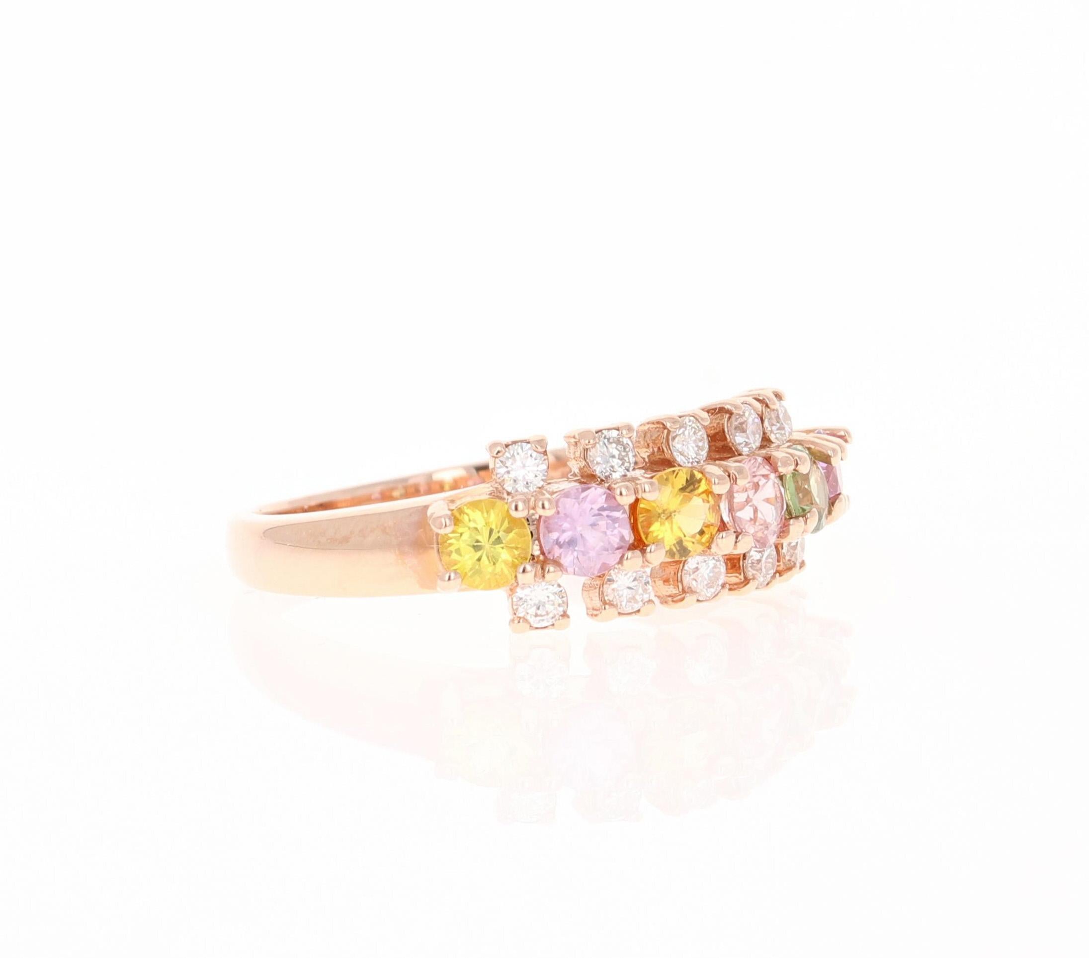 
This ring has 6 Round Cut Natural Multi-Colored Sapphires that weigh 0.95 Carats. It also has 10 Round Cut Diamonds that weigh 0.24 Carats. Clarity: VS and Color: H. The total carat weight of the ring is 1.19 Carats. 

The ring is beautifully set