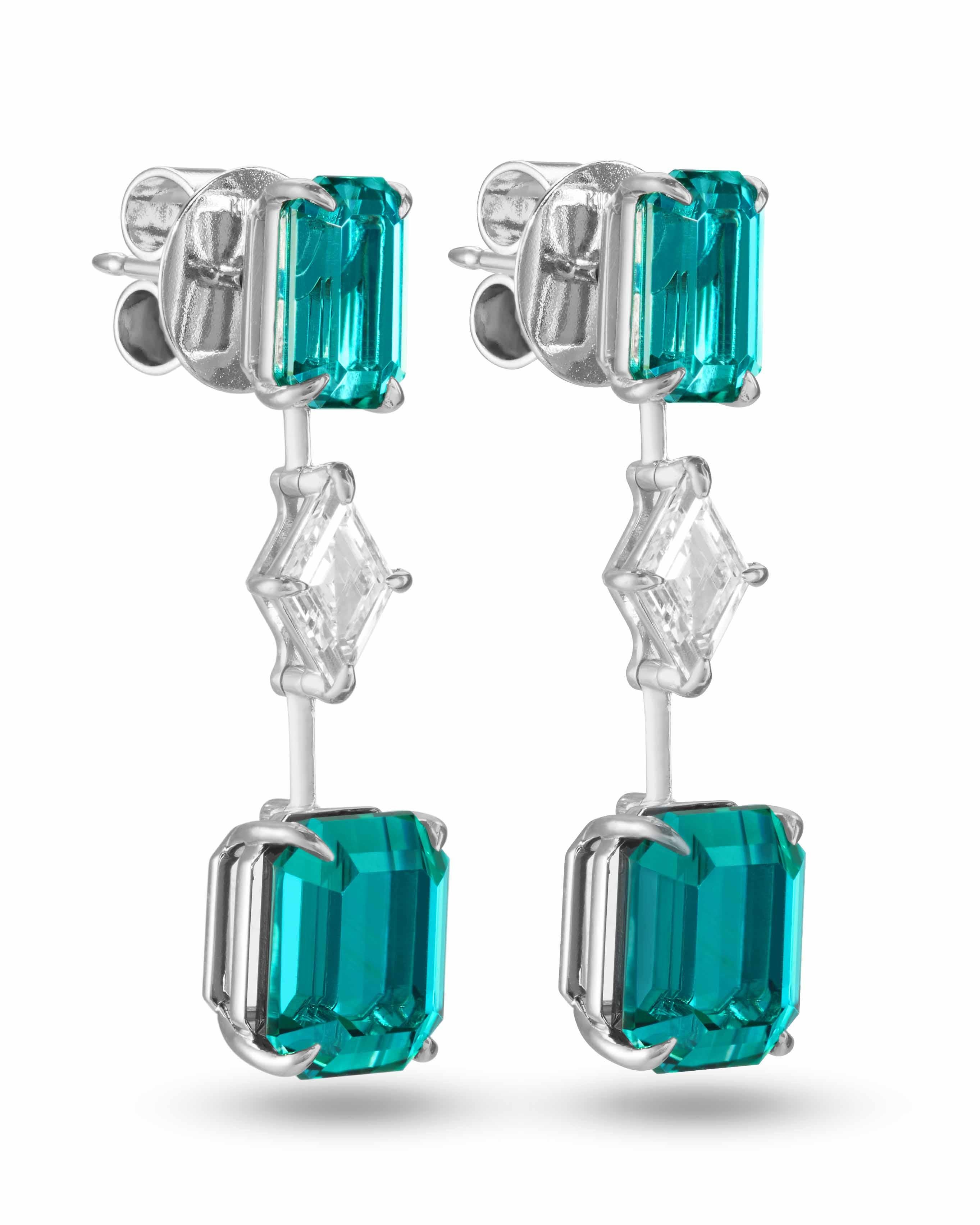 Featured in British VOGUE Jewellery Designer Profile June 2023 issue.
From the One-of-a-Kind collection, each LAGOON earring has two emerald-cut vibrant lagoon tourmalines with neon-like color and one lozenge-cut diamond set in an 18K white gold
